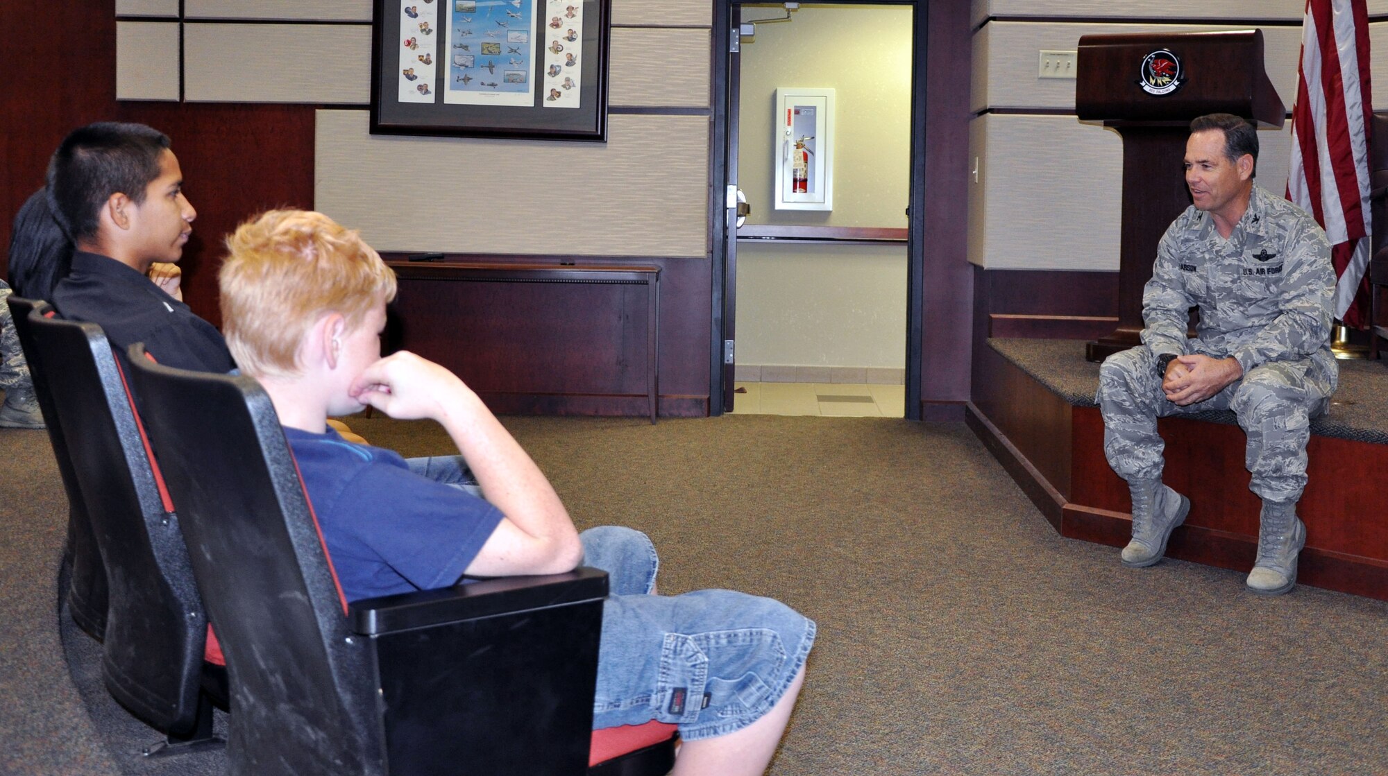 Col. Mark S. Larson, commander of the 931st Air Refueling Group, McConnell Air Force Base, Kan., visits with members of Big Brothers Big Sisters of Sedwick County, Sept. 8, 2012.  Children in the Big Brothers Big Sisters program were able to see a static display of a KC-135 Stratotanker, meet with several members of the 931st, and saw demonstrations of various Air Force career fields during the day.  (U.S. Air Force photo by 1st Lt. Zach Anderson
