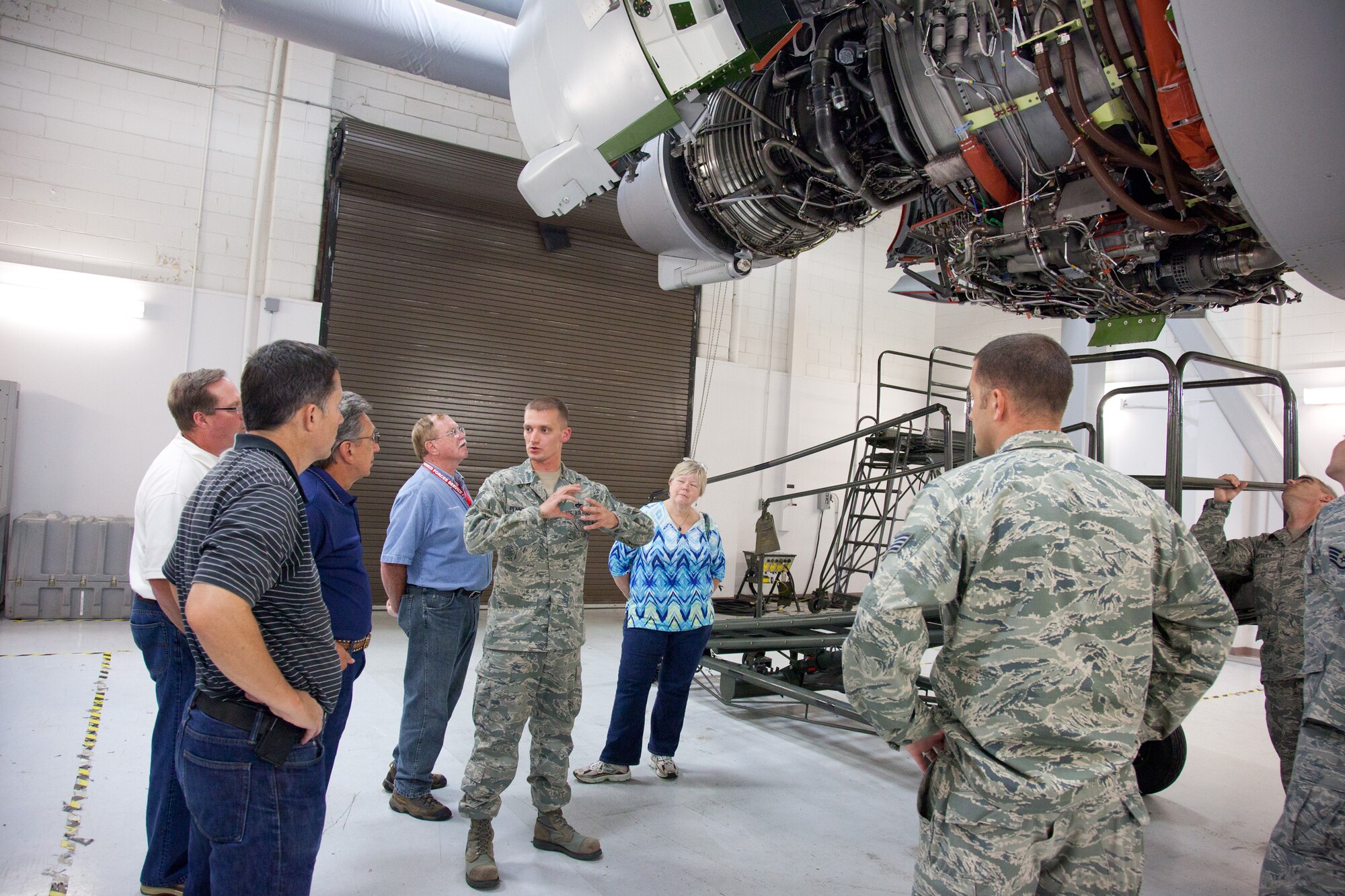 Tech. Sgt. Robert Pennington describes the parts of a C-17 engine to members of the 2012 Civic Leader tour from Minneapolis while at the Joint Base Charleston, SC.  (U.S. Air Force Photo/Shannon McKay)