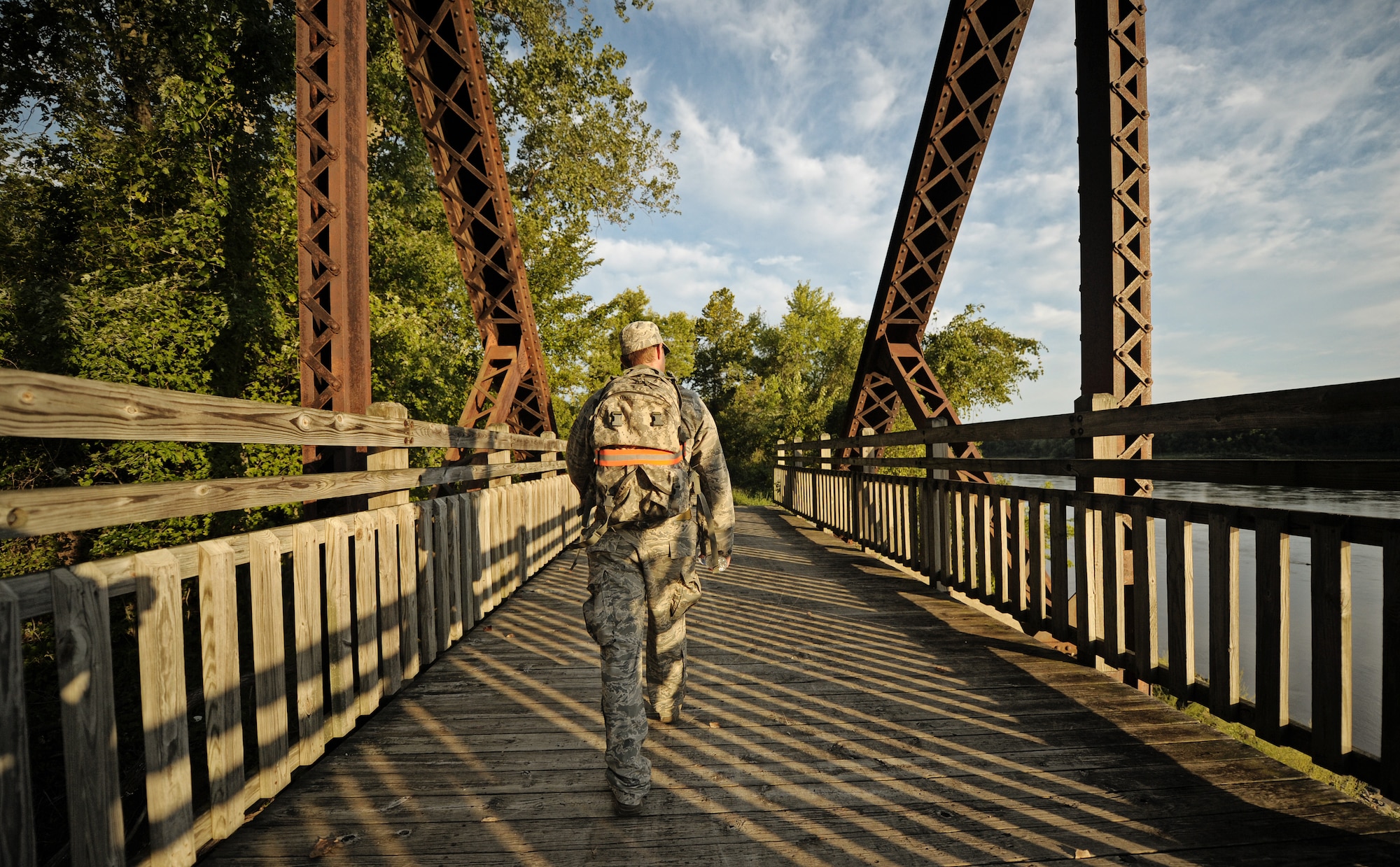 Airman 1st Class Nicholas Jewitt, Tactical Air Control Party specialist from the 10th Air Support Operations Squadron, Fort Riley Kan., carries a ruck sack along a 370 mile march near St. Louis, Mo. Sept. 6, 2012. The ruck sack contains the Silver Star medal being posthumously awarded to Senior Airman Bradley Smith for his actions while serving in Afghanistan. His unit spent a week marching his medal from Kansas to Troy, Ill., for the ceremony. (U.S. Air Force photo/ Staff Sgt. Ryan Crane)
