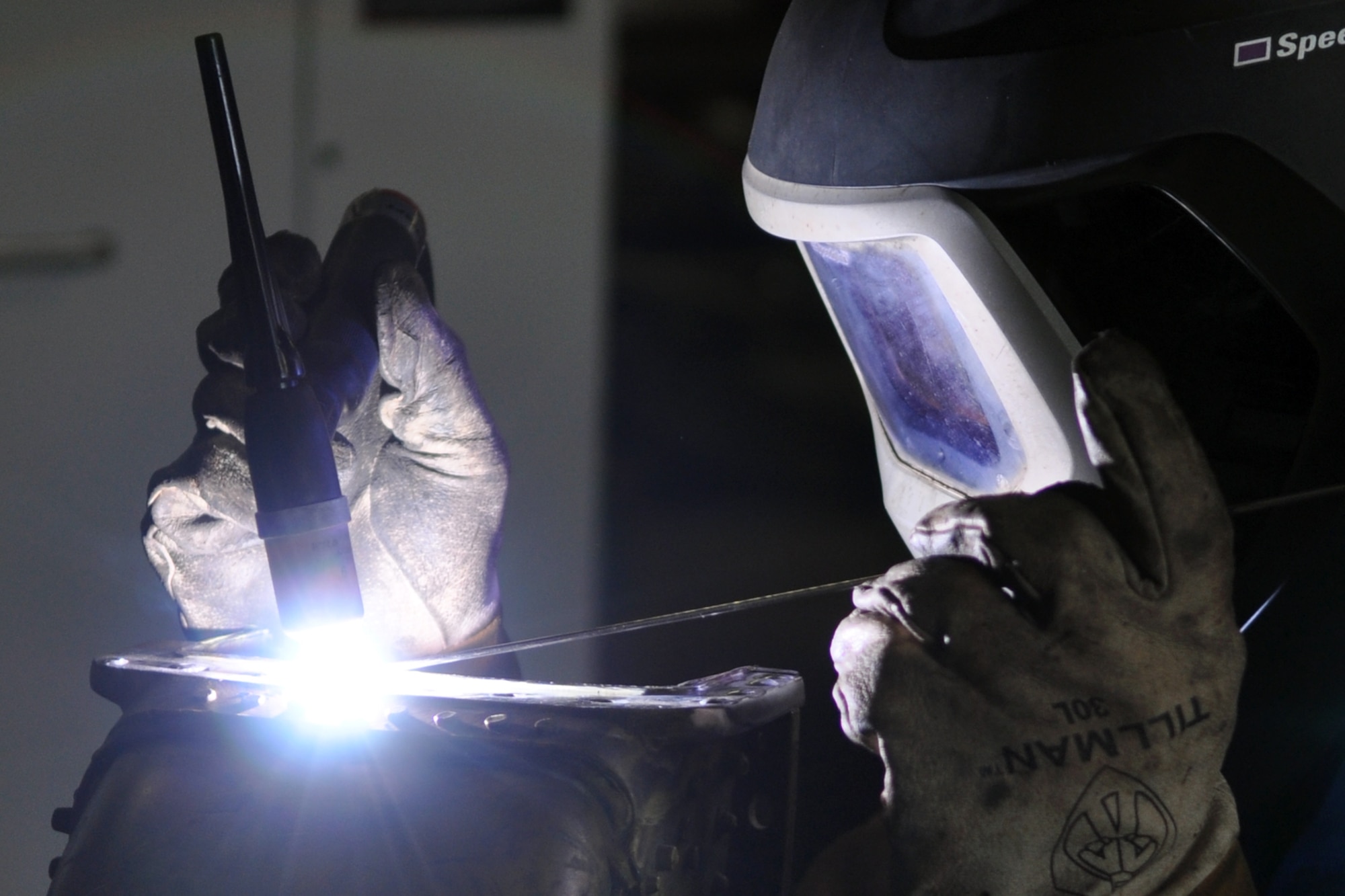 Tech. Sgt. Robert Posey, an aircraft machinist and welder assigned to the 307th Maintenance Squadron, Barksdale Air Force Base, La., completes some aluminum welding on an air cowling for a B-52 Stratofortress at Minot Air Force Base, N.D., Sept. 4, 2012. Posey was filling oversized rivet holes in the cowling so they could be re-drilled. He was one of 42 Airmen from Barksdale who deployed to Minot in support of NORTHERN BREAK. (U.S. Air Force photo by Master Sgt. Jeff Walston/Released)   