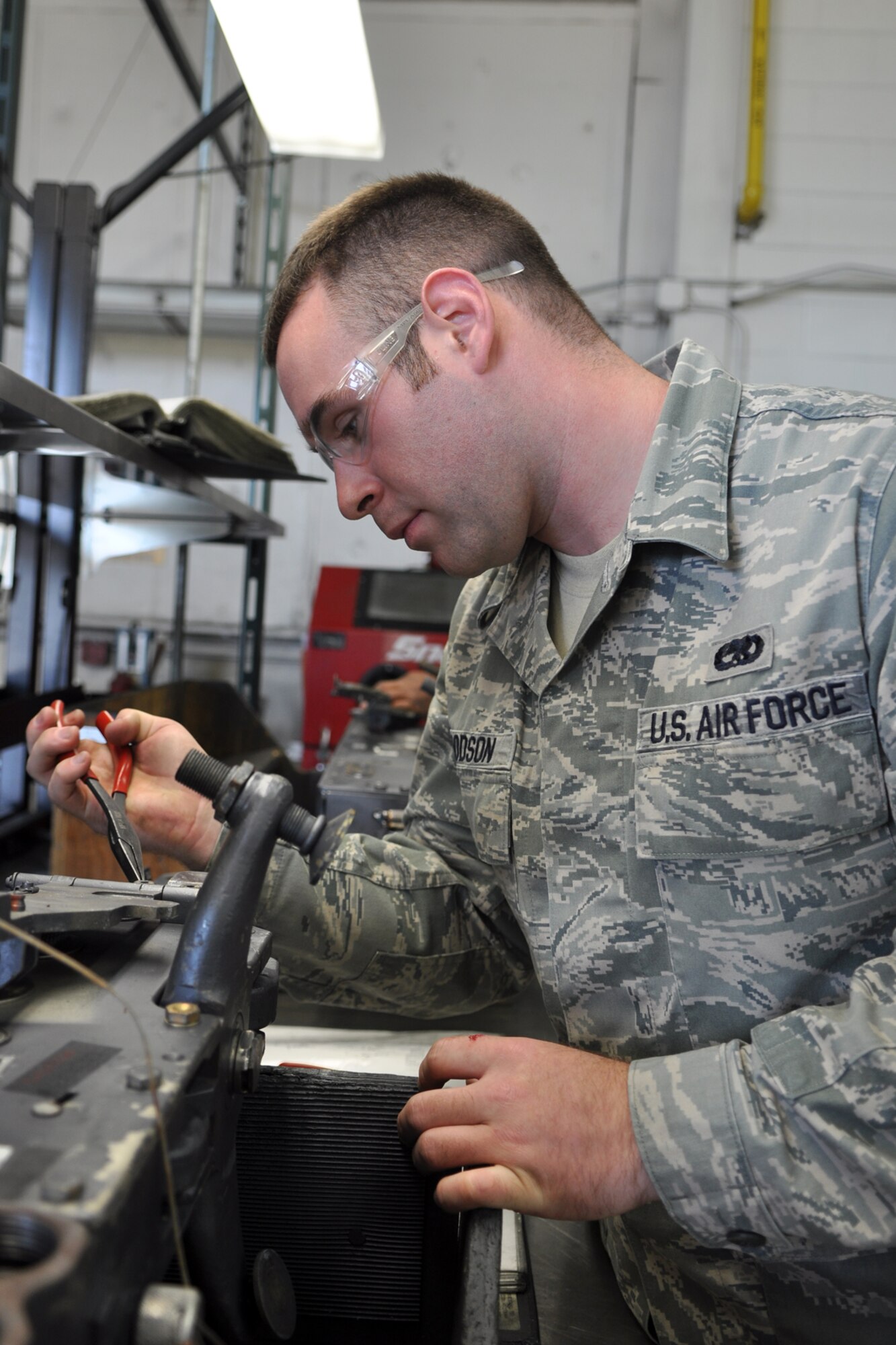 Senior Airman Christopher Goodson, an armament systems technician assigned to the 307th Maintenance Squadron, Barksdale Air Force Base, La., disassembles the face plate of a MAU-12 bomb rack for a B-52 Stratofortress at Minot Air Force Base, N.D., Sept. 4, 2102. Goodson was one of 42 Airmen from Barksdale who deployed to Minot in support of NORTHERN BREAK. (U.S. Air Force photo by Master Sgt. Jeff Walston/Released)   
