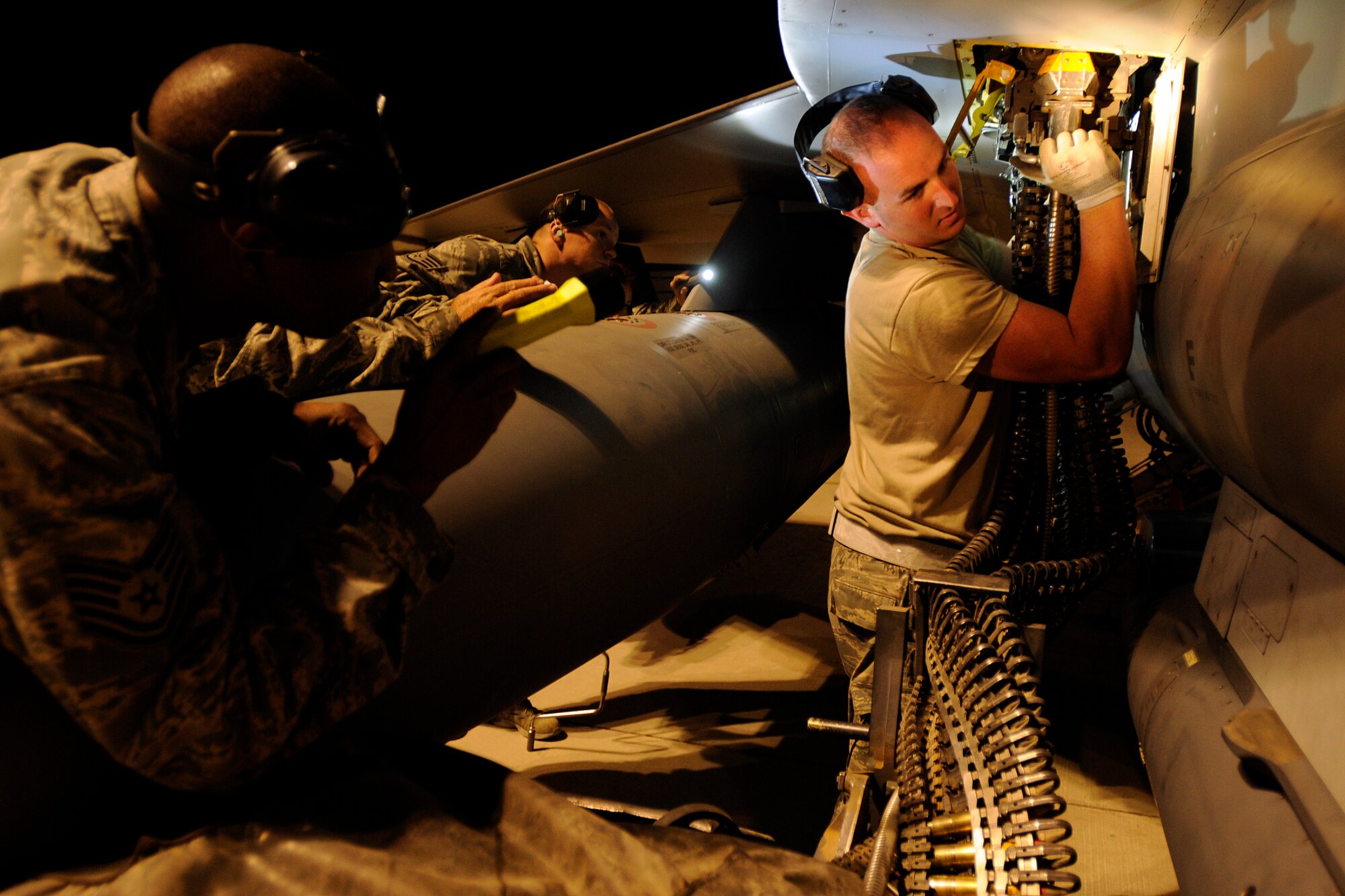 Airman 1st Class Bryan Martin, a weapons loader assigned to the 451st Expeditionary Aircraft Maintenance Squadron at Kandahar Airfield, Afghanistan, uses the Universal Ammunition Loading System to upload 20 mm rounds into an F-16 Fighting Falcon, April 22, 2012. Personnel are deployed from McEntire Joint National Guard Base, S.C., in support of Operation Enduring Freedom. Swamp Fox F-16's, pilots, and support personnel began their Air Expeditionary Force deployment early April to take over flying missions for the air tasking order and provide close air support for troops on the ground in Afghanistan.
(U.S. Air Force photo/TSgt. Caycee Cook)
