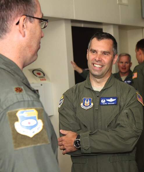 Col. Karl E. Goerke, 932nd Airlift Wing Operations Group commander, enjoys a conversation with Maj. Eric Berg, Operations Support Flight, following Goerke's assumption of command ceremony recently, at the base theater.  Berg was the Master of Ceremony for the event.  (U.S. Air Force photo/Tech. Sgt. Chris Parr)

