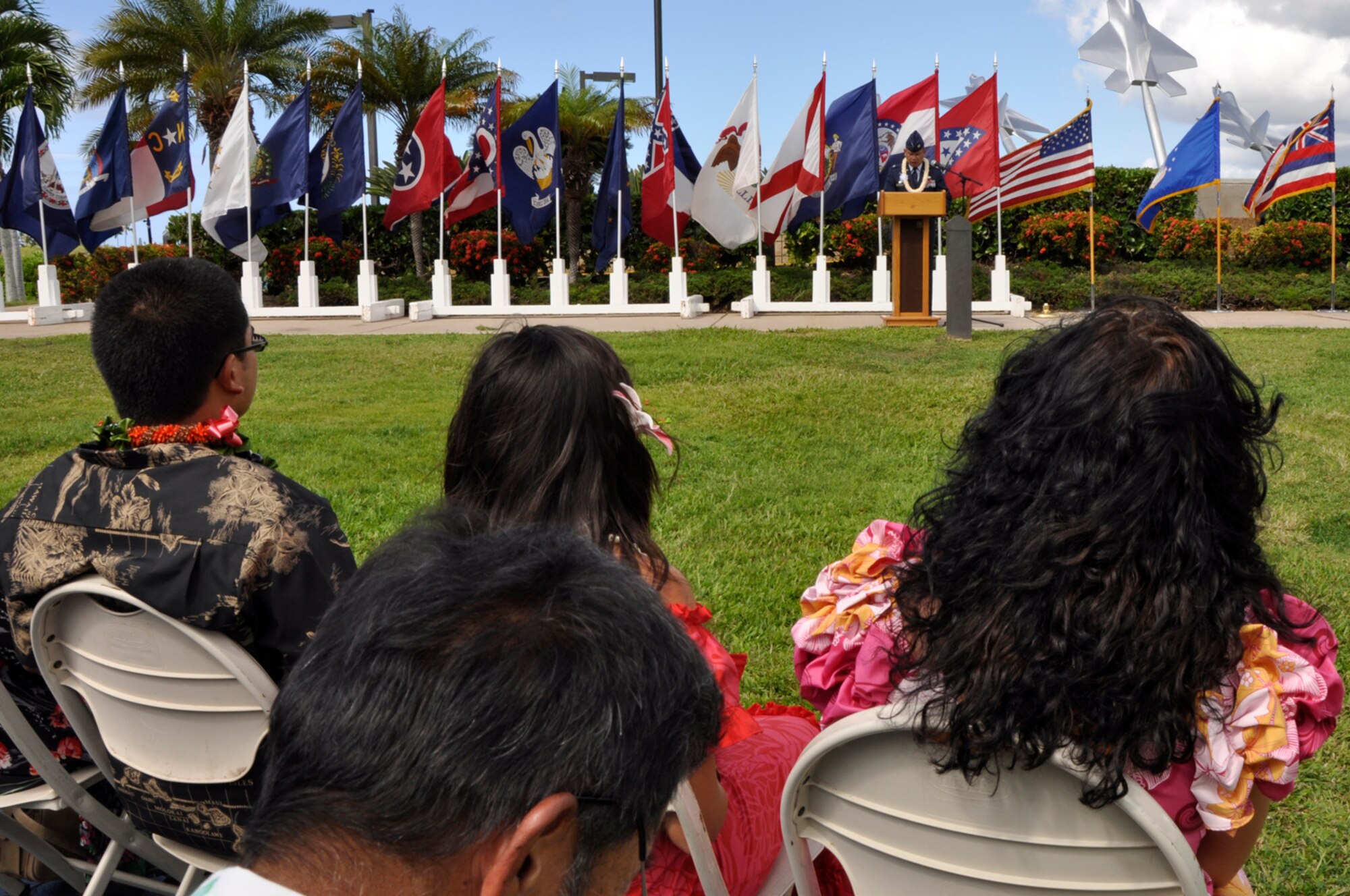 JOINT BASE PEARL HARBOR-HICKAM, Hawaii -- The family of Col. Maynard “Max” Mendoza watch him give his remarks after assuming command of the 624th Regional Support Group during a ceremony held Sept. 8 at the Missing Man Formation, Aloha Aina Park, here. Colonel Mendoza is now responsible for managing the largest Air Force Reserve presence in the Pacific, which is comprised of six units in Hawaii and Guam. The group provides combatant commanders more than 650 combat-ready Airmen who specialize in aerial port, aeromedical staging, civil engineering and security forces operations for worldwide deployment. (Air Force photo by Master Sgt. Daniel Nathaniel III)