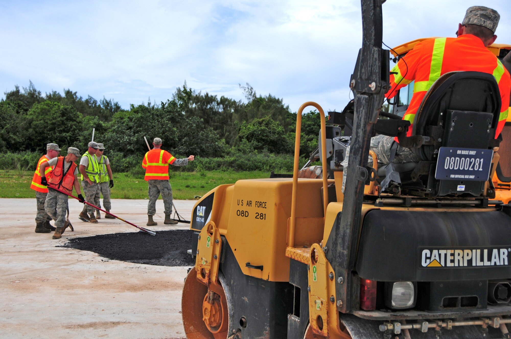 ANDERSEN AIR FORCE BASE, Guam – The 36th Civil Engineer Squadron airfield damage repair team finishes up by leveling the new material with the rest of the airfield during training at Northwest Field here, Aug. 30. The Airmen simulated a missile crater at the new airfield damage repair pad in order to train on one of their core contingency competencies. (U.S. Air Force photo by Airman 1st Class Marianique Santos/Released)