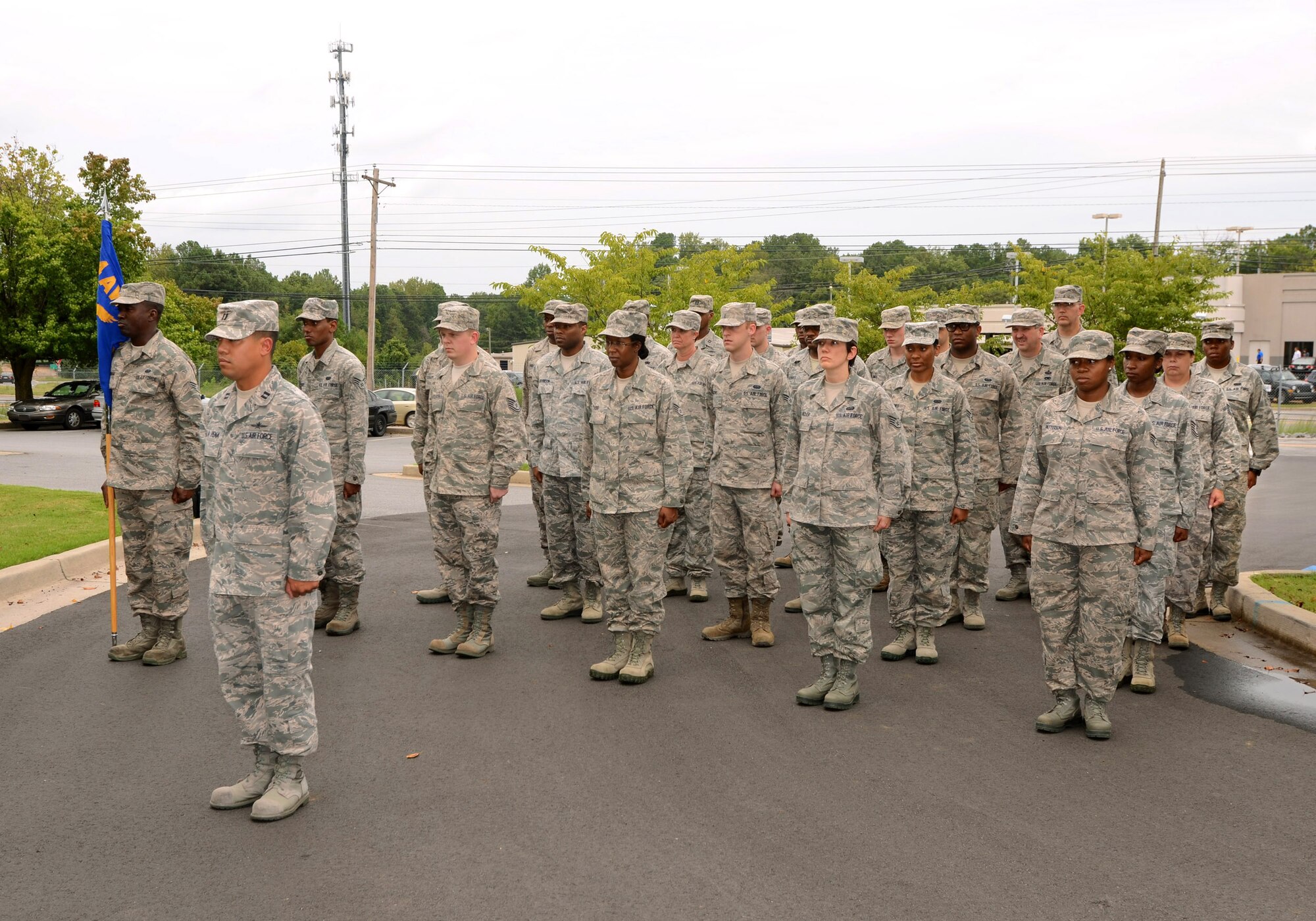 Members of the 94th Communications Squadron stand at attention at a retreat ceremony at Dobbins Air Reserve Base for the 94th Airlift Wing during the September drill weekend, Sept. 8.  (U.S. Air Force photo/Brad Fallin)