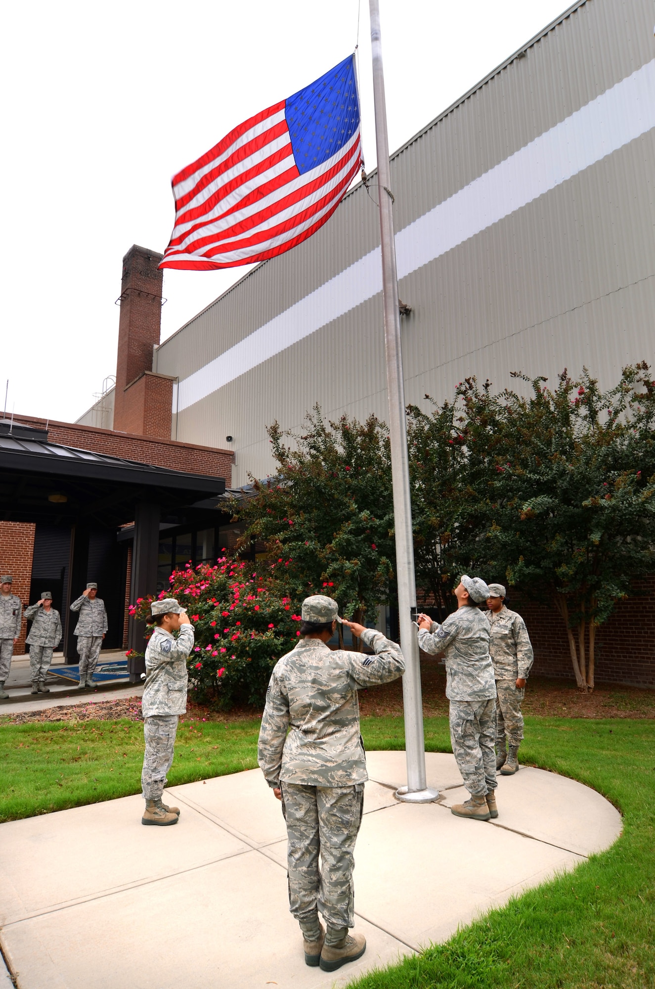 Members of the 94th Communications Squadron had the honor of performing a retreat ceremony at Dobbins Air Reserve Base on Sept. 8. Master Sgt. Lena Tamplin led the detail, which included Tech. Sgt. Stephen Athey,  Staff Sgt. Ashley Hanshaw and Senior Airman Cynthia Carson. (U.S. Air Force photo/Brad Fallin)