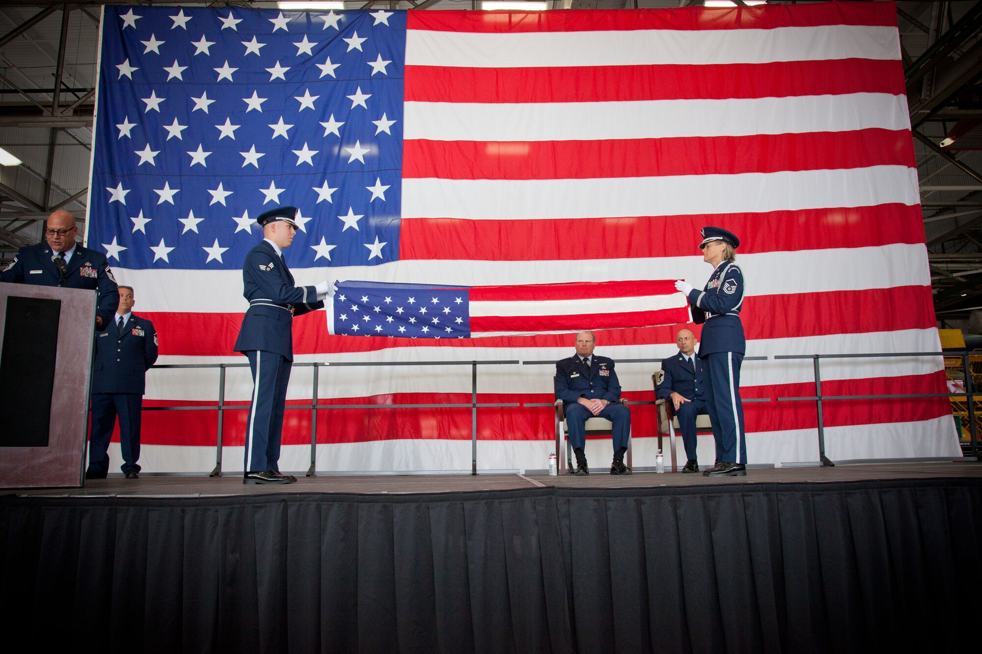 The Honor Guard performs the Tribute to the Flag of the United States of America during the retirement ceremony of Chief Master Sgt. Richard J. Karpinski, superintendent for the 934th Maintenance Group.  CMSgt. Karpinski retires after being assigned to the 934th Airlift Wing since May, 1986.  (U.S. Air Force Photo/Shannon McKay)