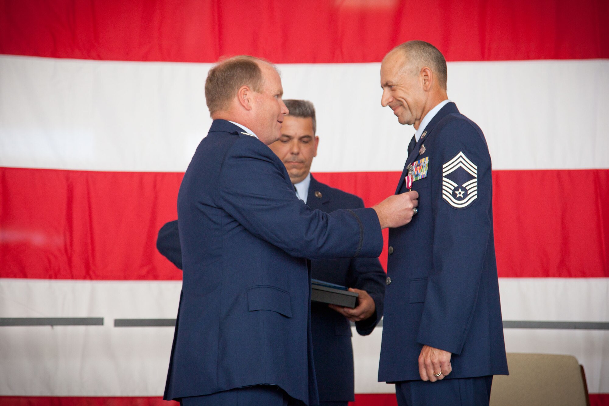 Col. Cam J. Le Blanc, Commander of the 934th Maintenance Group presents Chief Master Sgt. Richard J. Karpinski, superintendent for the 934 MXG, with his Meritorious Service award.  CMSgt. Karpinski retires after being assigned to the 934th Airlift Wing since May, 1986.  (U.S. Air Force Photo/Shannon McKay)
