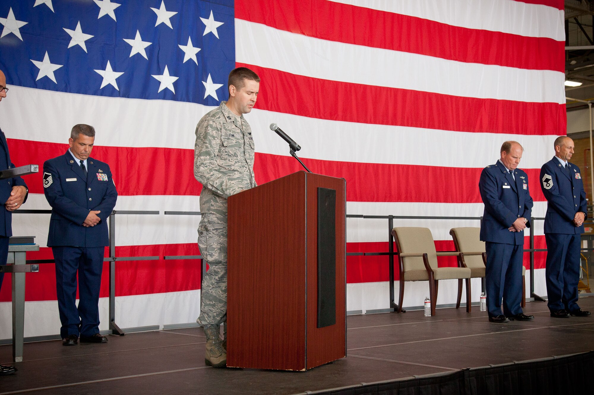 Capt. David C. Fink says the invocation at the retirement ceremony for Chief Master Sgt. Richard J. Karpinski, superintendent for the 934th Maintenance Group. CMSgt. Karpinski retires after being assigned to the 934th Airlift Wing since May, 1986.  (U.S. Air Force Photo/Shannon McKay)