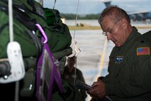 WESTOVER AIR RESERVE BASE, Mass. -- U.S. Air Force Lt. Col. Bruce Shepley, 439th Aeromedical Evacuation Squadron flight nurse and flight instructor, runs the pre-flight checklist during a quarterly readiness mission at Westover Air Reserve Base, Mass., Aug. 10, 2012. The readiness mission is in accordance with the training requirements to stay wartime ready in their career field. (U.S. Air Force photo/Staff Sgt. Megan Tomkins)