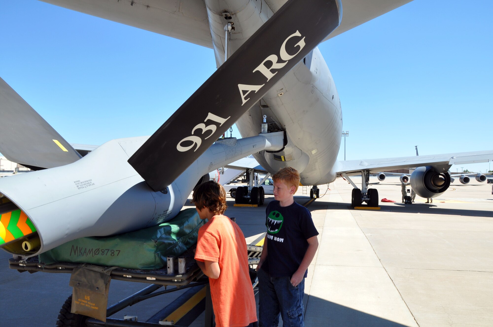 Members of the Big Brothers Big Sisters of Sedgwick County get an up close look at a the refueling boom of a KC-135 Stratotanker on the flight line at McConnell Air Force Base, Kan., Sept. 8, 2012.  The 931st Air Refueling Group hosted a tour for children in the organization and provided demonstrations of the many different careers available within the Air Force Reserve.  (U.S. Air Force photo by Staff Sgt. Carrie M. Peasinger)