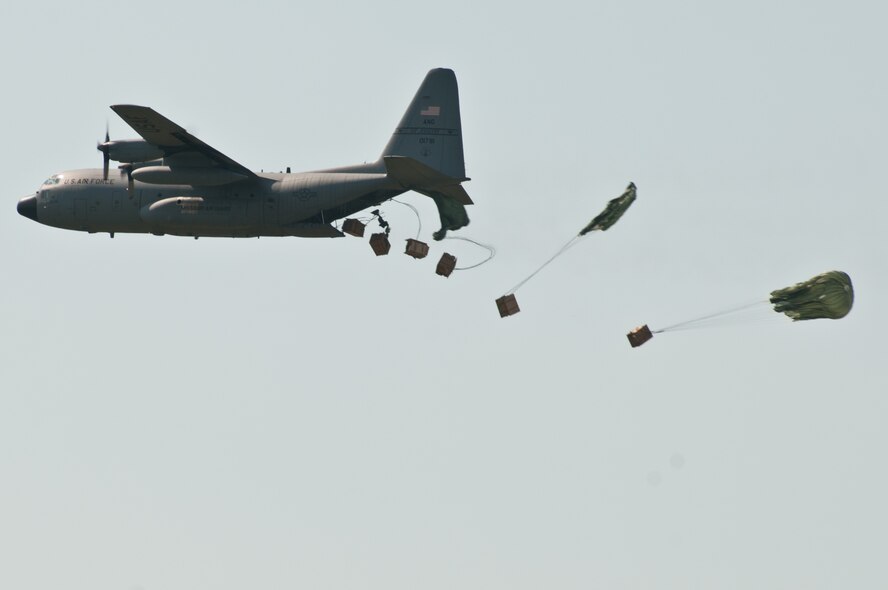 A C-130 from the 139th Airlift Wing conducts a Low Cost Low Altitude (LCLA) airdrop at Rosecrans Air National Guard Base on Thursday, September 6, 2012, St. Joseph, Mo. (U.S. Air Force Photo by Senior Airman Kelsey Ramirez/RELEASED)