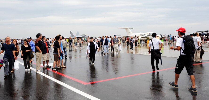 Japanese and Americans enjoy the Air Festival at Misawa Air Base, Japan, Sept. 9, 2012. Thousands of people from across Japan visited Misawa Air Base for this annual event, which displayed the teamwork and openness shared by U.S. and Japan forces. (U.S. Air Force photo by Airman 1st Class Kenna Jackson/Released)