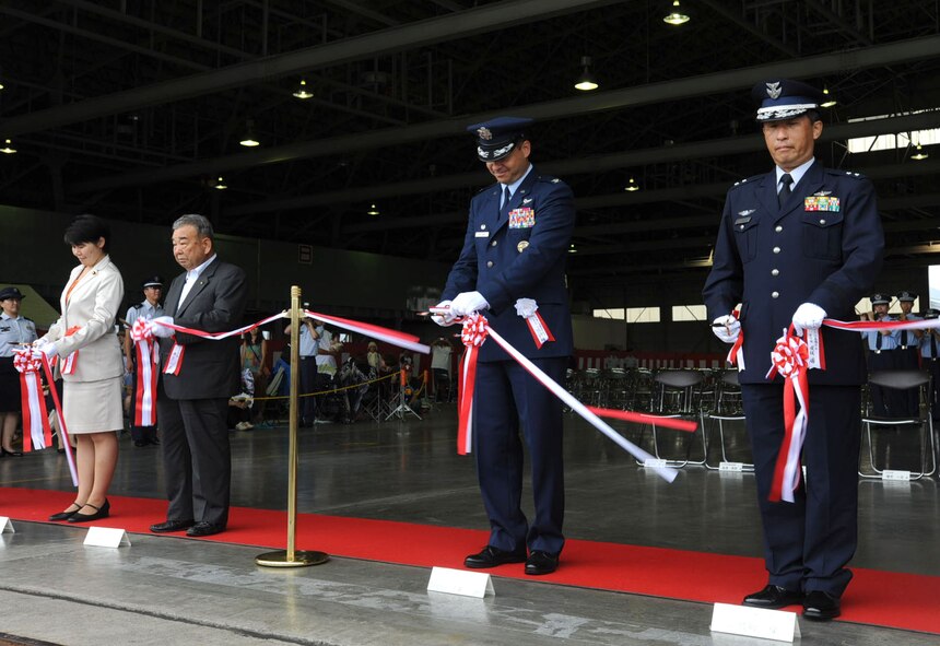 U.S. and Japanese officials cut the ribbon to symbolize the start of the Misawa Air Festival at Misawa Air Base, Japan, Sept. 9, 2012. Thousands of people had an opportunity to enjoy foods and entertainment venues sponsored by the U.S. and the Japan Air Self-Defense Force. (U.S. Air Force photo by Airman 1st Class Kenna Jackson/Released)