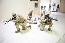 Corpsmen rehearse providing security and treat a mock causality after exiting a Humvee egression assistance trainer during a training event at Camp Hansen Aug. 29. Once the trainer stopped, the corpsmen assessed and treated mock casualties sustained during the crash. The corpsmen are part of 3rd Medical Battalion, Combat Logistics Regiment 35, 3rd Marine Logistics Group, III Marine Expeditionary Force.

