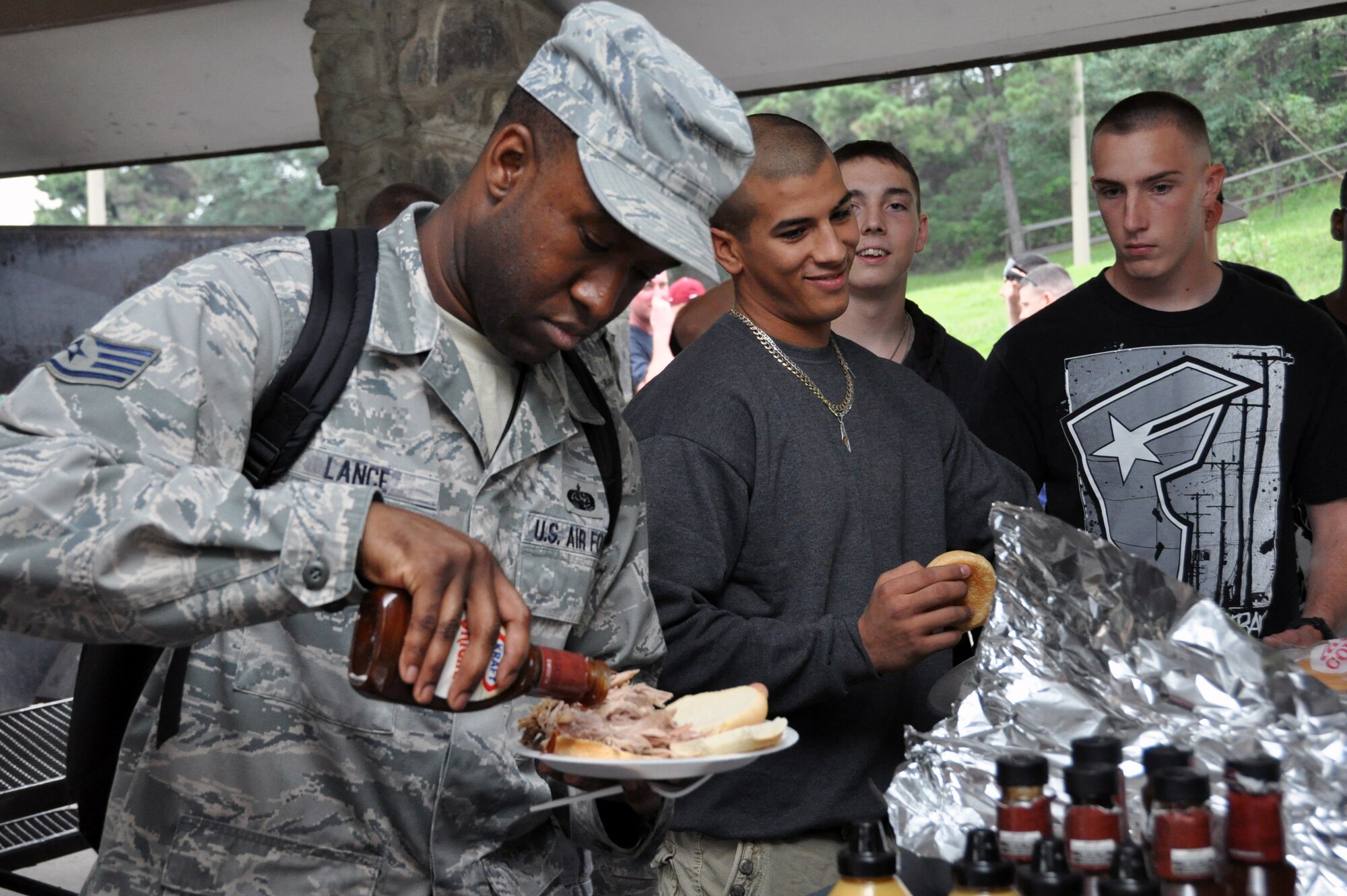 Staff Sgt. Raymond Lance enjoys a roasted pork sandwich during a first sergeant pig roast for single and unaccompanied Airmen at Osan Air Base, Republic of Korea, Sept. 7, 2012. Airmen had a chance to relax and enjoy free food while getting to know their first sergeants at the first- time event. Lance is a 6th Intelligence Squadron knowledge operations management NCO. (U.S. Air Force photo/Senior Airman Michael Battles) 