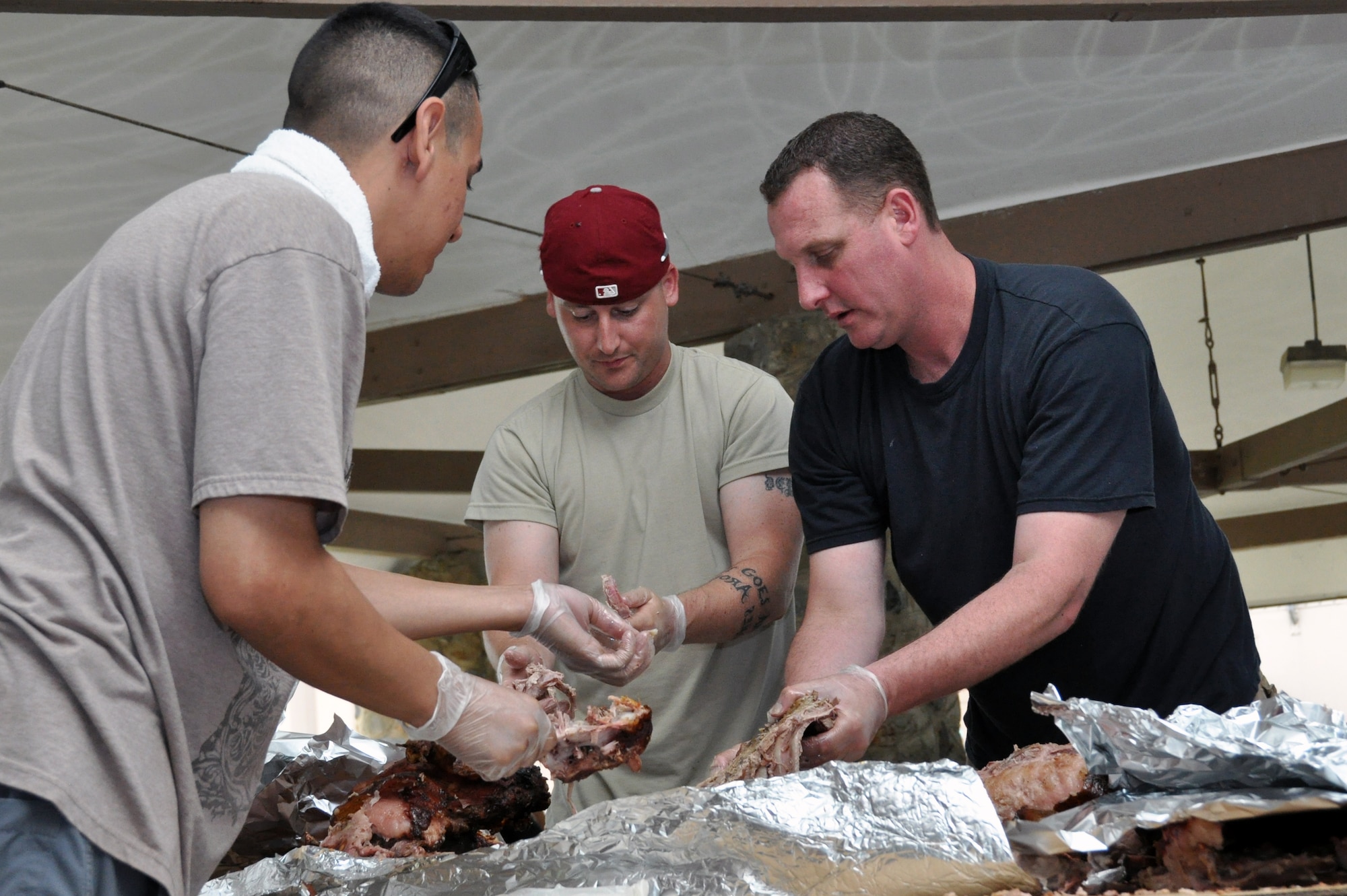 Volunteers from Team Osan came together to help support the first-ever pig roast for single and unaccompanied Airmen at Osan Air Base, Republic of Korea, Sept. 7, 2012. The first sergeants hosted the event and provided free food and drinks. The event also gave Airmen a chance to talk to and get to know their first sergeants. (U.S. Air Force photo/Senior Airman Michael Battles)