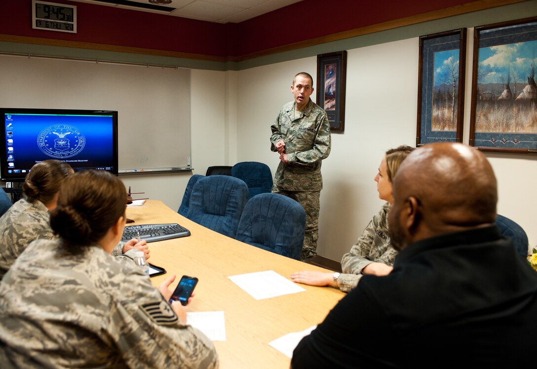 Staff Sgt. Matthew Auger, 28th Civil Engineer Squadron heating and air conditioning technician, gives an impromptu speech to members of 28th Bomb Wing equal opportunity office staff during internship training at Ellsworth Air Force Base, S.D., Sept. 6, 2012. Airmen aspiring to be EO advisors must complete 20 days of on-the-job training before advancing to a technical school. (U.S. Air Force photo by Airman 1st Class Alystria Maurer/Released)