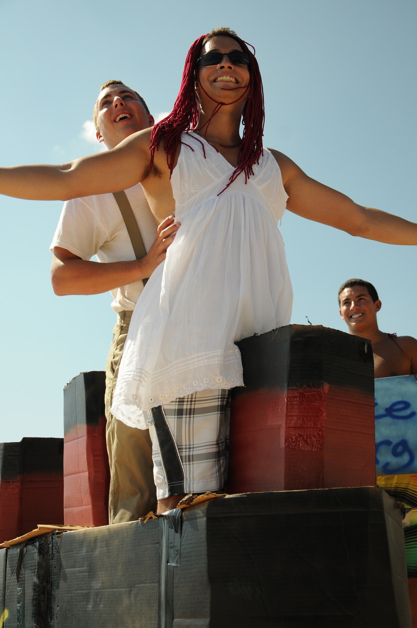 LAUGHLIN AIR FORCE BASE, Texas -  2nd Lt. Chris Dyer, secured by 2nd Lt. Alex Kingsley, leans over the bow of the “R.M.S. Titanic,” their team’s entry in Laughlin’s 6th annual cardboard boat race.  A total of 14 teams came together to compete in the event Sept. 4.  (U.S. Air Force photo/ 2nd Lt. Daniel Brand) 