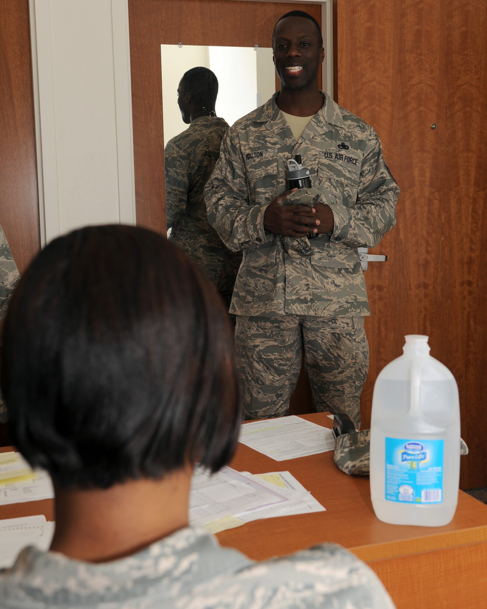 U.S. Air Force Tech. Sgt. Ebony Leach, 355th Civil Engineer Squadron Airman dormitory leader, talks with Master Sgt. Eddie Walton, 355th Maintenance Operations Squadron, about some of his Airmen in the dorms on Davis-Monthan Air Force Base, Ariz., Sept. 5, 2012. The ADLs provide assistance to dorm residents' supervisors and other leadership by allowing them access to rooms for room inspections and providing other information such as dorm regulations. (U.S. Air Force photo by Airman 1st Class Timothy Moore/Released)