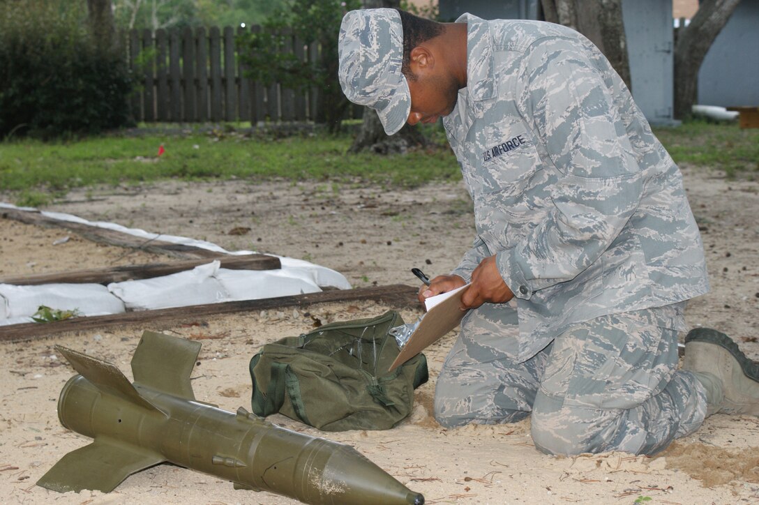 An EOD candidate from the 366th Training Squadron Field Training Detachment 3 at Eglin Air Force Base, Fla., works through a recon problem July 19, 2012.  The Airmen Out Of Training program was developed to help offset time spent out of normal courses at Naval School Explosive Ordnance Disposal due to administrative, medical or academic issues. (U.S. Air Force photo/Dan Hawkins)