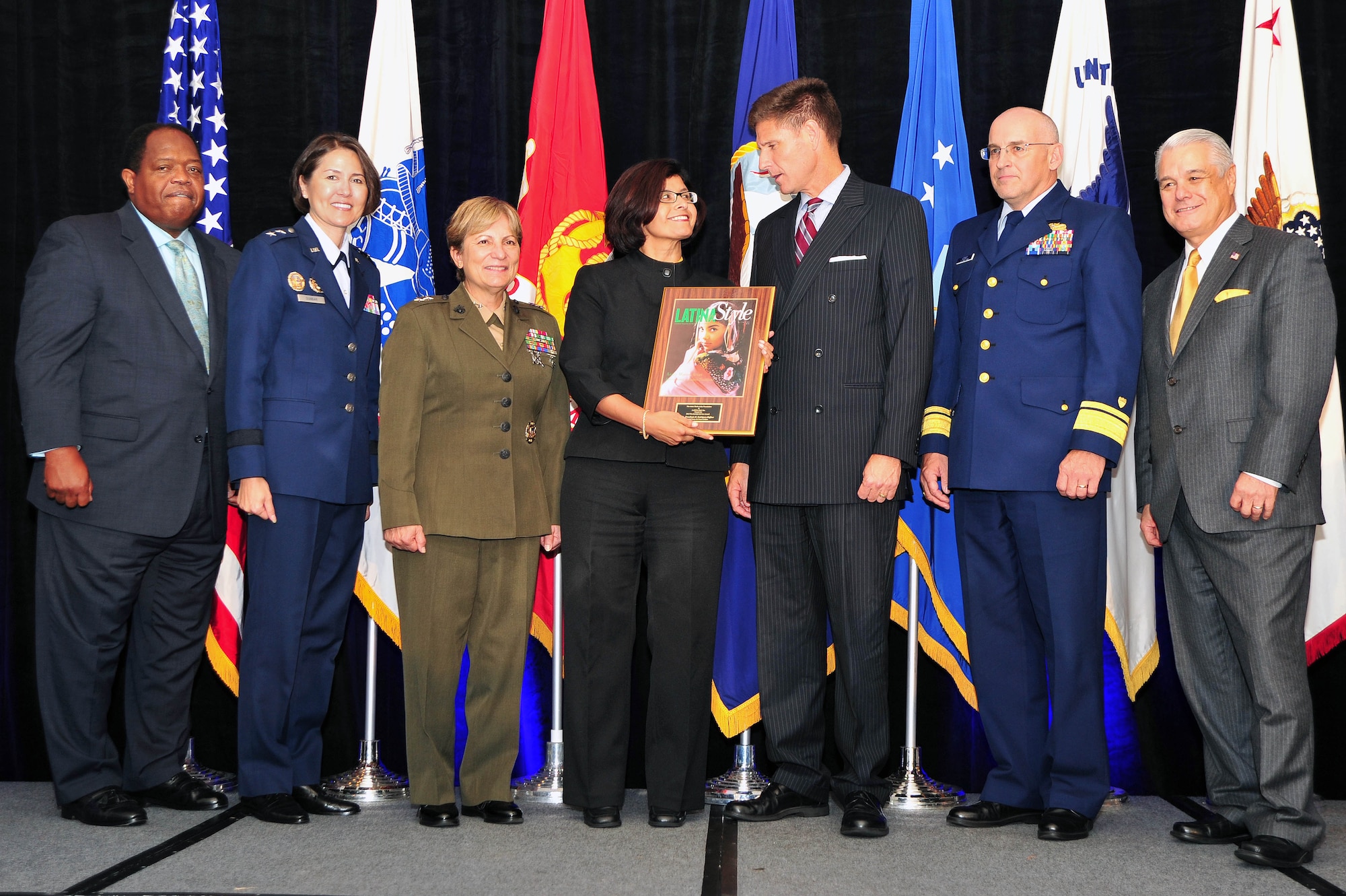 Military leadership and Latina Style Inc. partners present the 2012 Latina Style Meritorious Service Award to Ermelinda M. Rodriguez-Heffner, Air Force District of Washington Manpower, Personnel and Services director during the 9th Annual Latina Symposium Distinguished Military Awards Ceremony, Sept. 6, in Arlington, Va. Rodriguez-Heffner received the award for her unwavering dedication and a ?can do? attitude as a stand-out performer at AFDW and throughout the Latina community. (U.S. Air Force photo by Senior Airman Steele C. G. Britton)
