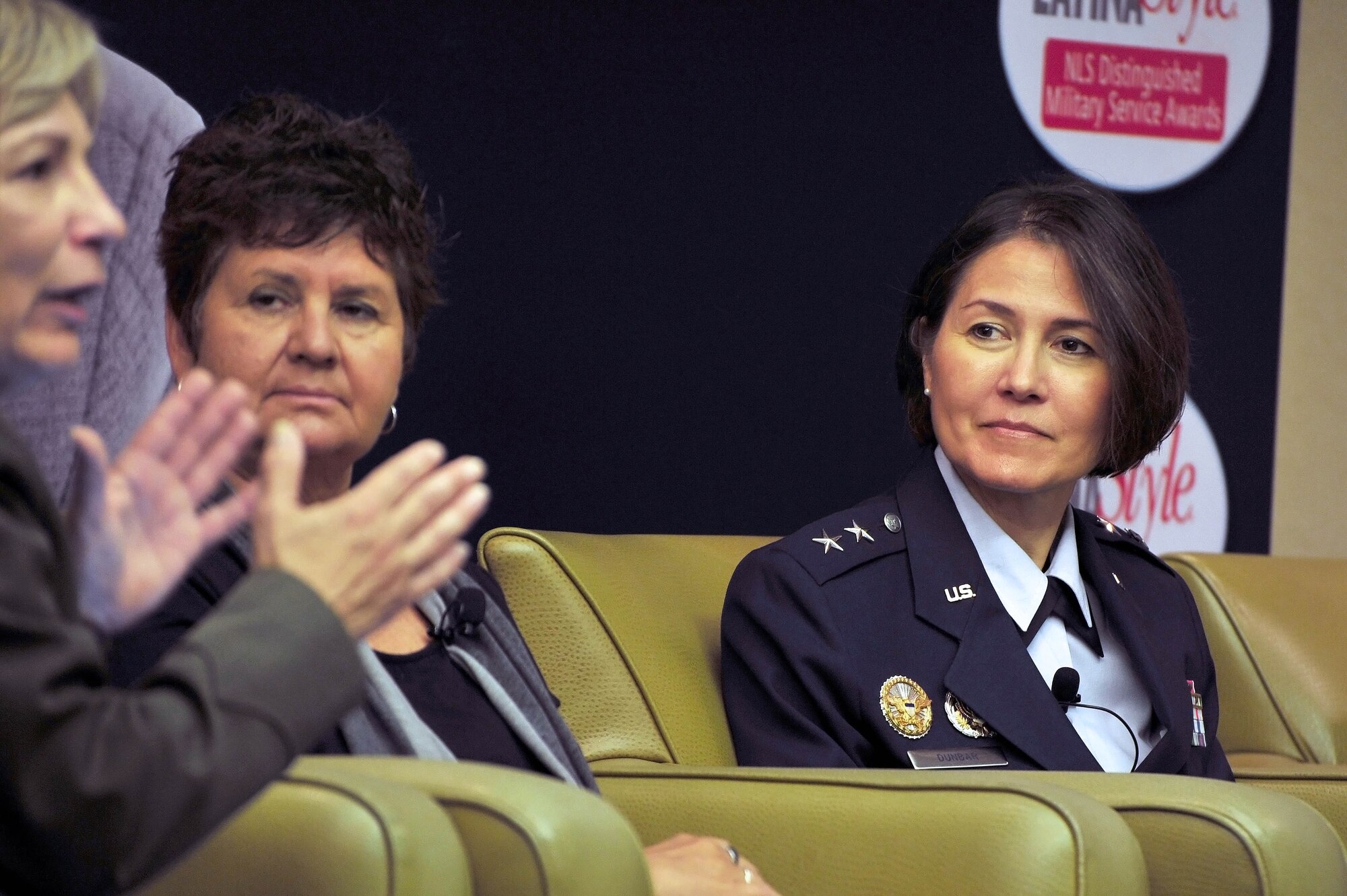 Air Force District of Washington Commander Maj. Gen. Sharon K. G. Dunbar listens to U.S. Marine Corps Manpower and Management Division Director Maj. Gen. Angela Salinas during a panel discussion about nurturing leadership and success at the 9th Annual Latina Symposium, Sept. 6, in Arlington, Va. The annual workshop sponsored by the Anna Maria Arias Foundation and Latina Style Inc., allowed participants to learn about advancing Latinas in the workplace, entrepreneurship and business, emerging technology trends, political leadership, professional development and balancing daily life with career and personal goals. (U.S. Air Force photo by Senior Airman Steele C. G. Britton)