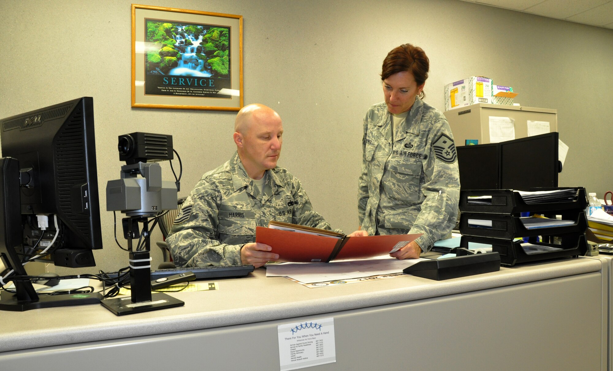 WHITEMAN AIR FORCE BASE, Mo. – Tech. Sergeant Eric Harris, 442nd Force Support Squadron chief of customer support, reviews family care plan documents with 1st Sgt. (Master Sgt.) Caran Walker, 442nd Force Support Squadron, to ensure Airmen have made plans for their loved ones. The 442nd FSS is part of the 442nd FW, an Air Force Reserve unit at Whiteman Air Force Base Mo. (U.S. Air Force photo by Tech. Sgt. Kent Kagarise/Released)