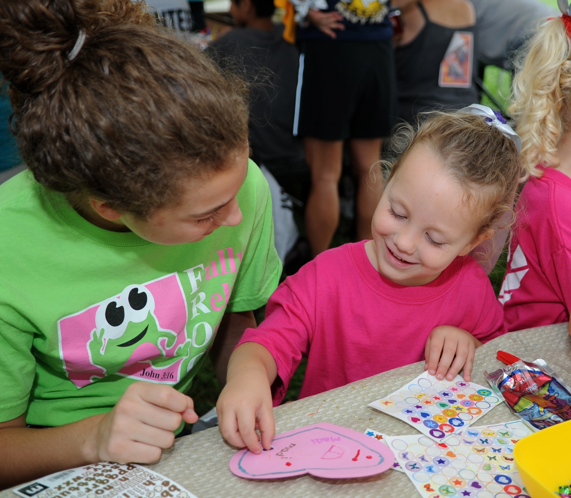 Naomi-Lynn Brewington, left, and Madison Valentz, right, daughters of U.S. Air Force Master Sgt. Alison Lambert, 633rd Medical Support Squadron acquisitions manger noncommissioned officer in charge, play with arts and crafts during the Out of the Darkness Walk, designed to promote suicide awareness, at Mount Trashmore Park in Virginia Beach, Va., Sept. 8, 2012. This event provided increased awareness of depression as a disease, and of the tragedy of suicide. (U.S. Air Force photo by Senior Airman Racheal Watson/Released)