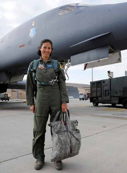 Capt. Monika Johncour, 28th Operations Support Squadron chief of wing scheduling, stands in front of a B-1 bomber on the flightline at Ellsworth Air Force Base, S.D., Sept. 7, 2012. A former United Airlines flight attendant, Johncour flew a regular route from Dallas, Texas, to San Francisco, Calif., and narrowly missed being on the flight that crashed in Shanksville, Pa., on 9/11. Johncour joined the U.S. Air Force soon after 9/11, and now flies with the 34th Bomb Squadron as a B-1 weapon systems officer. (U.S. Air Force photo by Airman Ashley J. Woolridge/Released) 