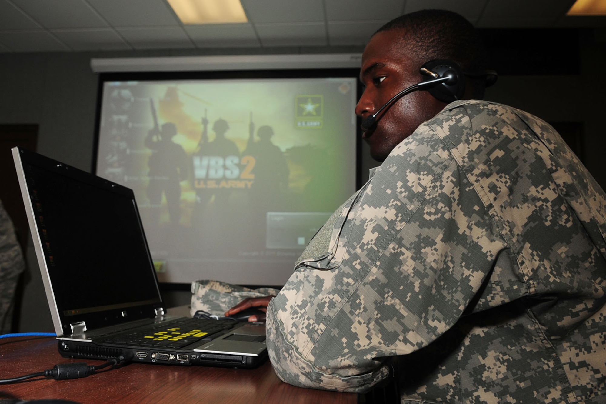 U.S. Army Pvt. Calvin Brown, 576th Inland Cargo Transfer Company cargo specialist, uses the Virtual Battle Space 2 computer training simulator at Fort Eustis, Va., Sept. 6, 2012. Soldiers conduct individual or collective training and break down into two rival teams to accomplish a variety of mission objectives. (U.S. Air Force photo by Staff Sgt. Ashley Hawkins/Released)