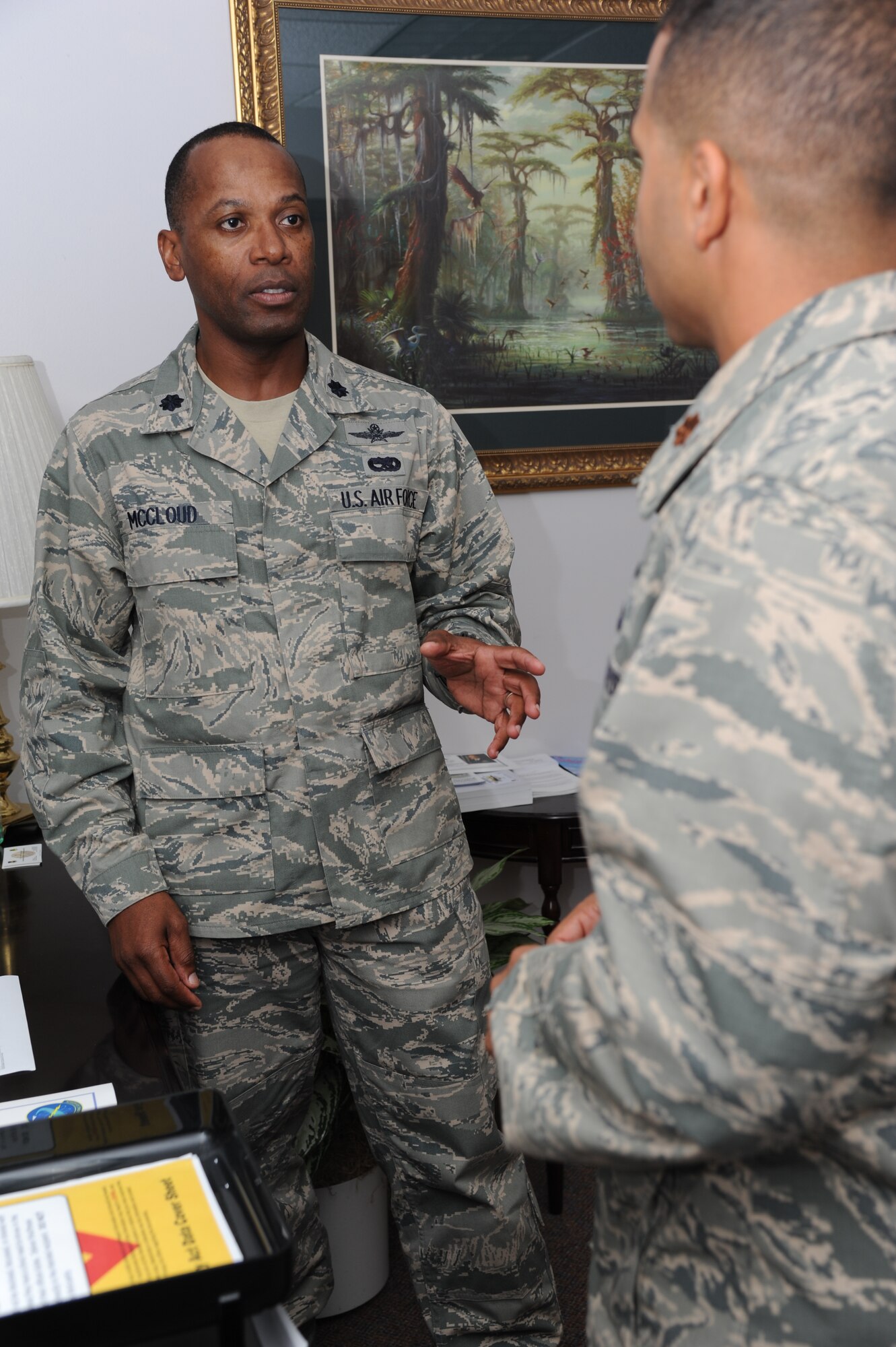 Lt. Col. Whitney McCloud, 333rd Training Squadron commander, and Maj. Wallace Reed, 333rd TRS director of operations, discuss shoring up squadron processes Aug. 23, 2012, at Stennis Hall, Keesler Air Force Base, Miss.  (U.S. Air Force photos by Kemberly Groue)