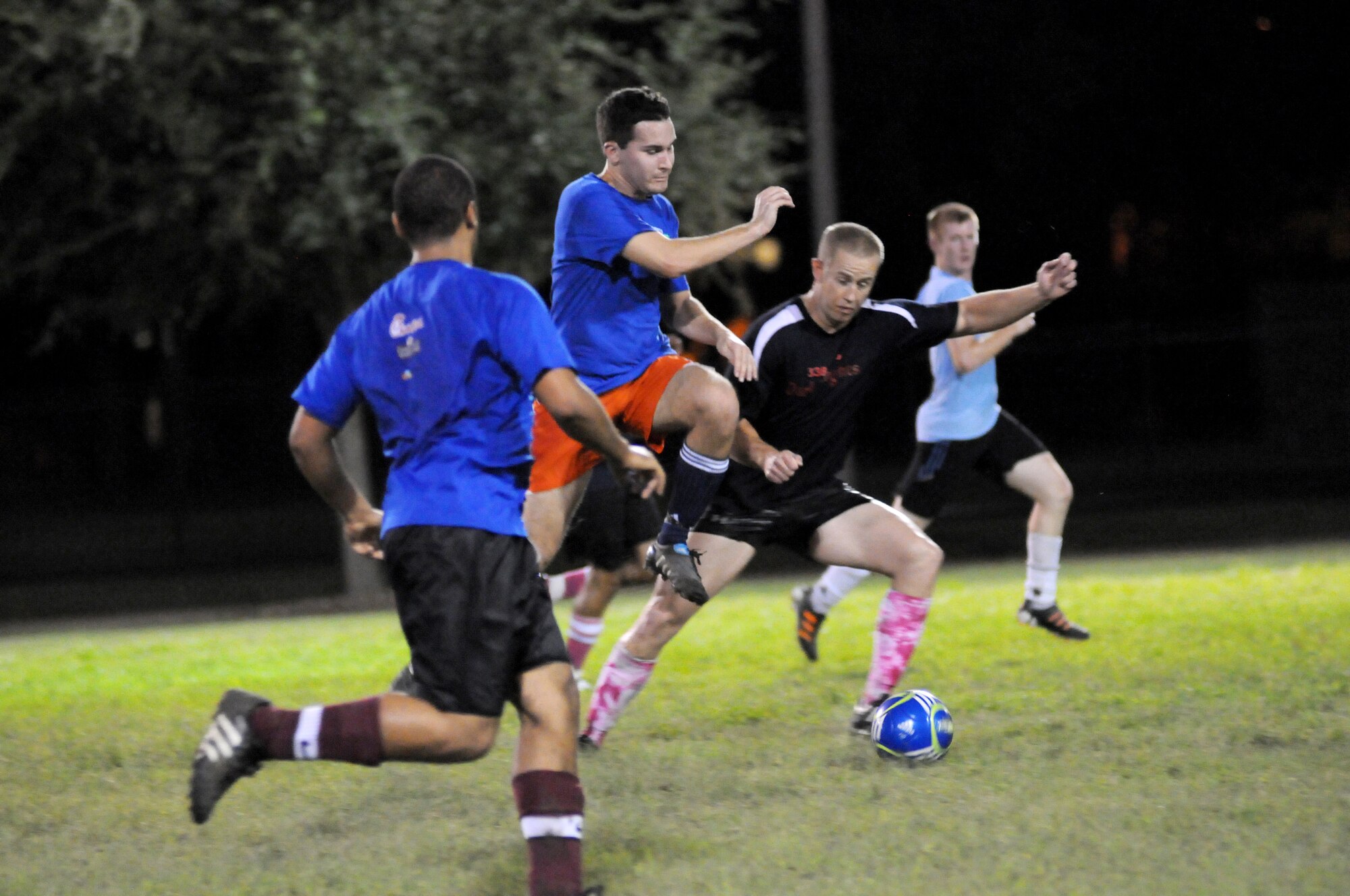 Joel Vandevrede, 333rd Training Squadron, leaps into the air to knock the soccer ball down in front of him as Austin Aitken, 338th Training Squadron, prepares to take the ball away from him Sept. 6, 2012, during an intramural soccer game against the 333rd Training Squadron at Keesler Air Force Base, Miss.  The Spartans defeated the Dark Knights 5-4.  (U.S. Air Force photo by Kemberly Groue)