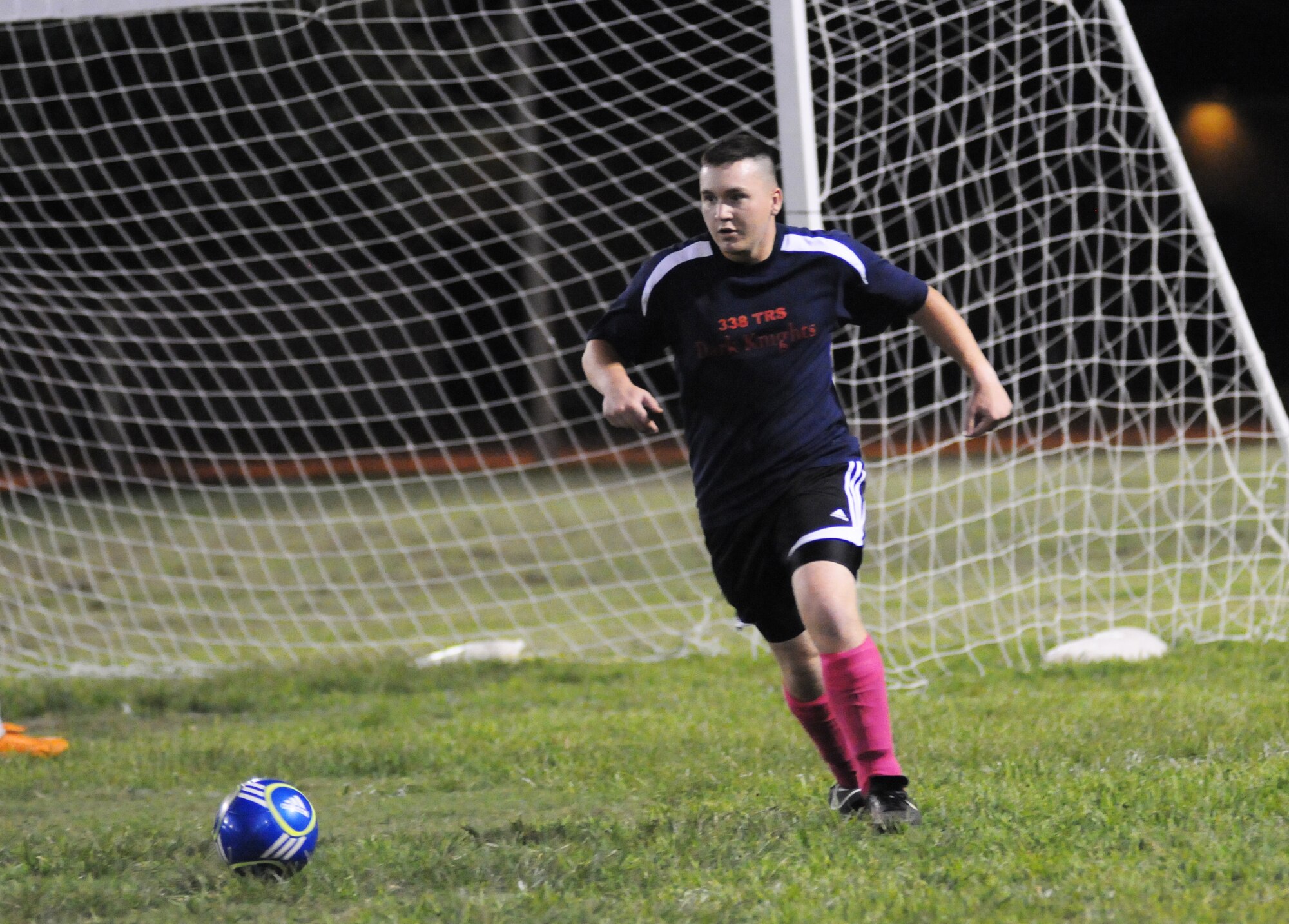 Nicholas Ceehorne, 338th Training Squadron, makes a pass to a teammate Sept. 6, 2012, during an intramural soccer game against the 333rd Training Squadron at Keesler Air Force Base, Miss.  The Spartans defeated the Dark Knights 5-4.  (U.S. Air Force photo by Kemberly Groue)