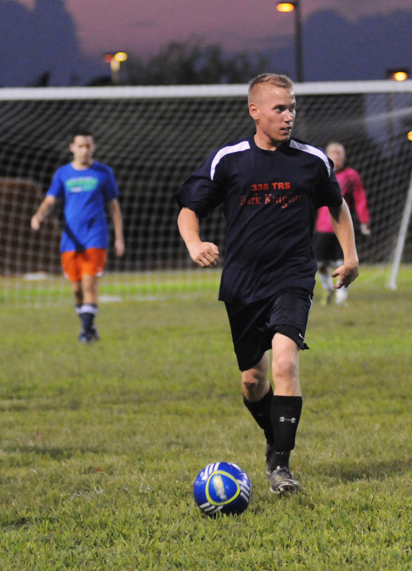 Keith Maurer, 338th Training Squadron, looks for an open pass Sept. 6, 2012, during an intramural soccer game against the 333rd Training Squadron at Keesler Air Force Base, Miss.  The Spartans defeated the Dark Knights 5-4.  (U.S. Air Force photo by Kemberly Groue)