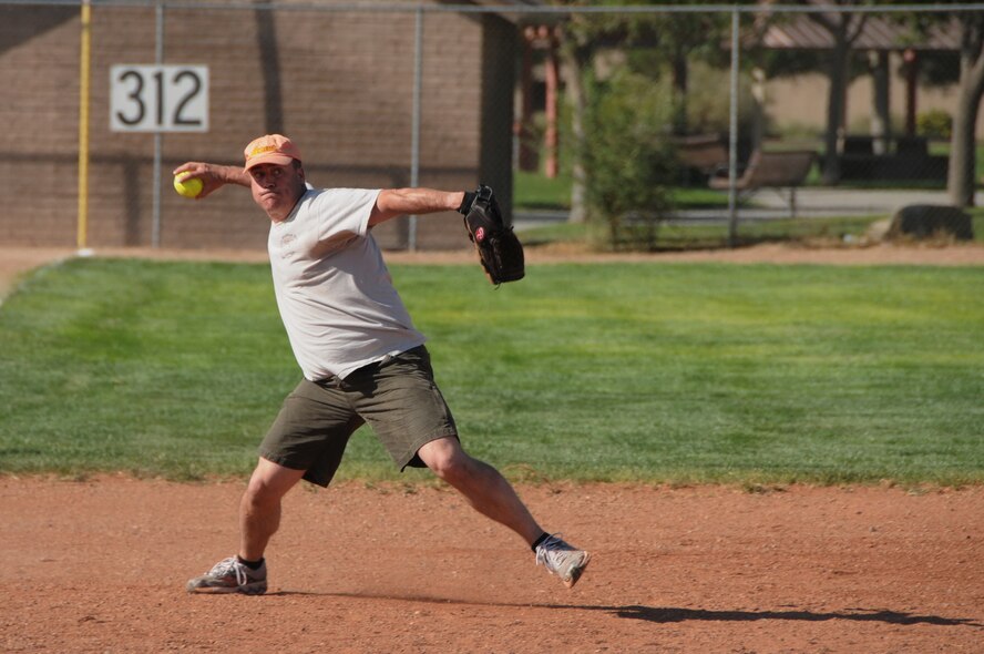 Col. Steve Reese, 377th Medical Group commander, prepares to throw across the diamond during the Chiefs versus Eagles game.

Photo by Ken Moore