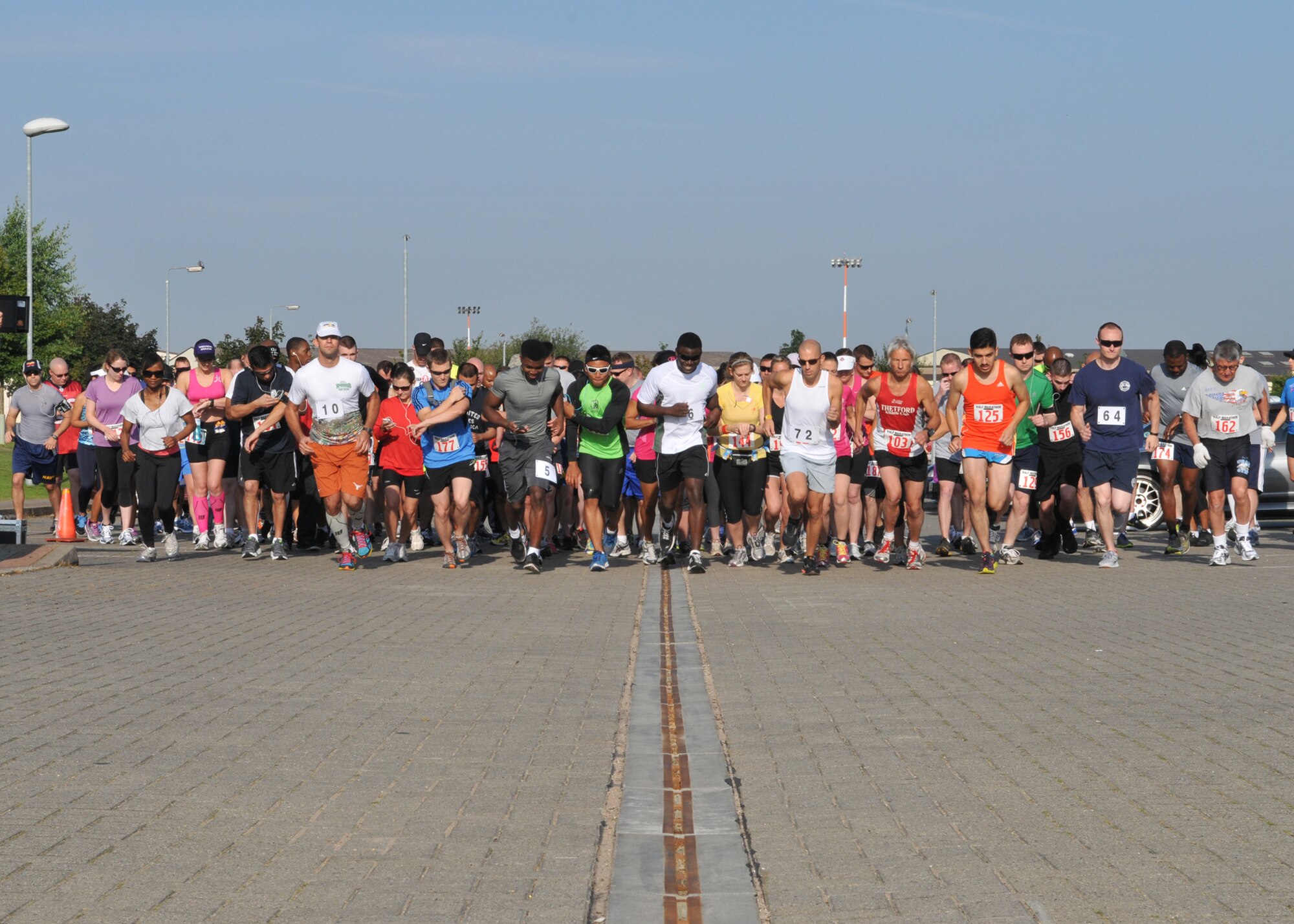RAF MILDENHALL, England – Participants begin the 4th Annual RAF Mildenhall Half Marathon Sept. 8, 2012, at the Hardstand Fitness Center. The race honored the families of wounded and lost military heroes. (U.S. Air Force photo/Staff Sgt. Tabitha Lee)