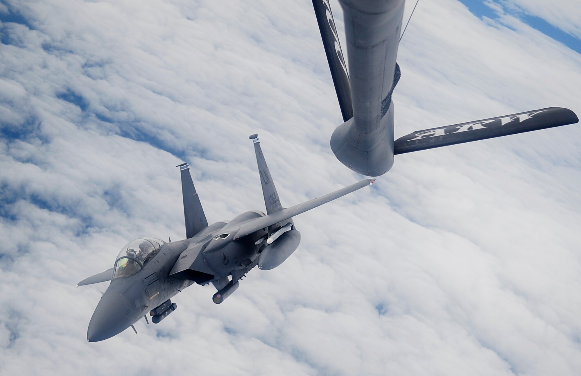 RAF MILDENHALL, England -- An F-15E Strike Eagle from the 48th Fighter Wing, RAF Lakenheath, flies away from a 100th Air Refueling Wing KC-135 Stratotanker after receiving fuel Sept. 10, 2012, over the Atlantic Ocean. The 100th ARW supports both training and real-world missions for U.S. and allied forces all over the world. (U.S. Air Force photo/Senior Airman Ethan Morgan)