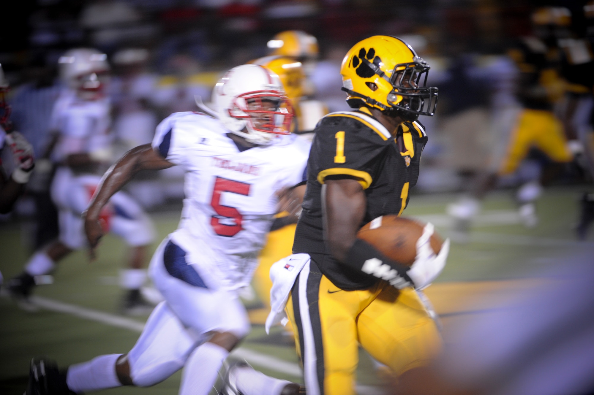 A receiver from the Valdosta High School Wildcats runs for a first down at the Bazemore-Hyder Stadium in Valdosta Ga., Sept. 7, 2012. The Brooks County High School Trojans defeated the Wildcats with a final score of 28-24. (U.S. Air Force photo by Senior Airman Douglas Ellis/Released)

