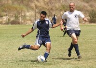 Warhawks midfielder David Ramos passes the ball forward in front of a Wright-Patterson defender during a Sept. 2 Defender Cup soccer matchup. Wright-Patterson eliminated the Warhawks, 4-1. (U.S. Air Force photo/Robbin Cresswell)