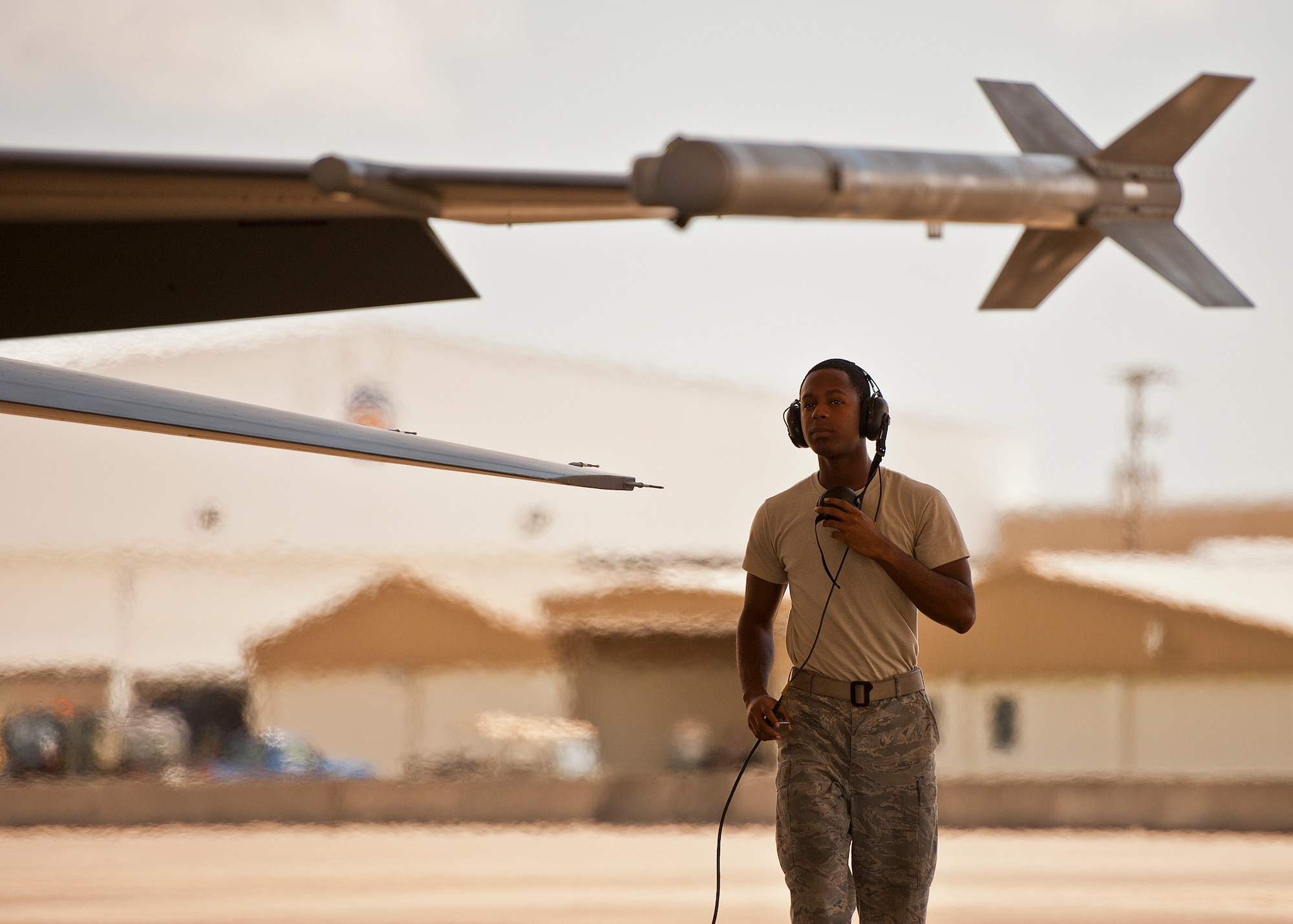 Senior Airman Dominique Wilson, a crew chief with the 309th Aircraft Maintenance Squadron, completes his pre-flight checks of an F-16 Fighting Falcon on the 33rd Fighter Wing flightline Sept. 6 at Eglin Air Force Base, Fla.  Approximately 36 Luke Air Force Base Airmen, assigned to the 309th, maintain four F-16s used as chase aircraft for F-35 flights and to maintain pilot proficiency.  Airmen from Luke’s various F-16 maintenance squadrons have been rotating to Eglin to support this mission since January 2011.  (U.S. Air Force photo/Samuel King Jr.)