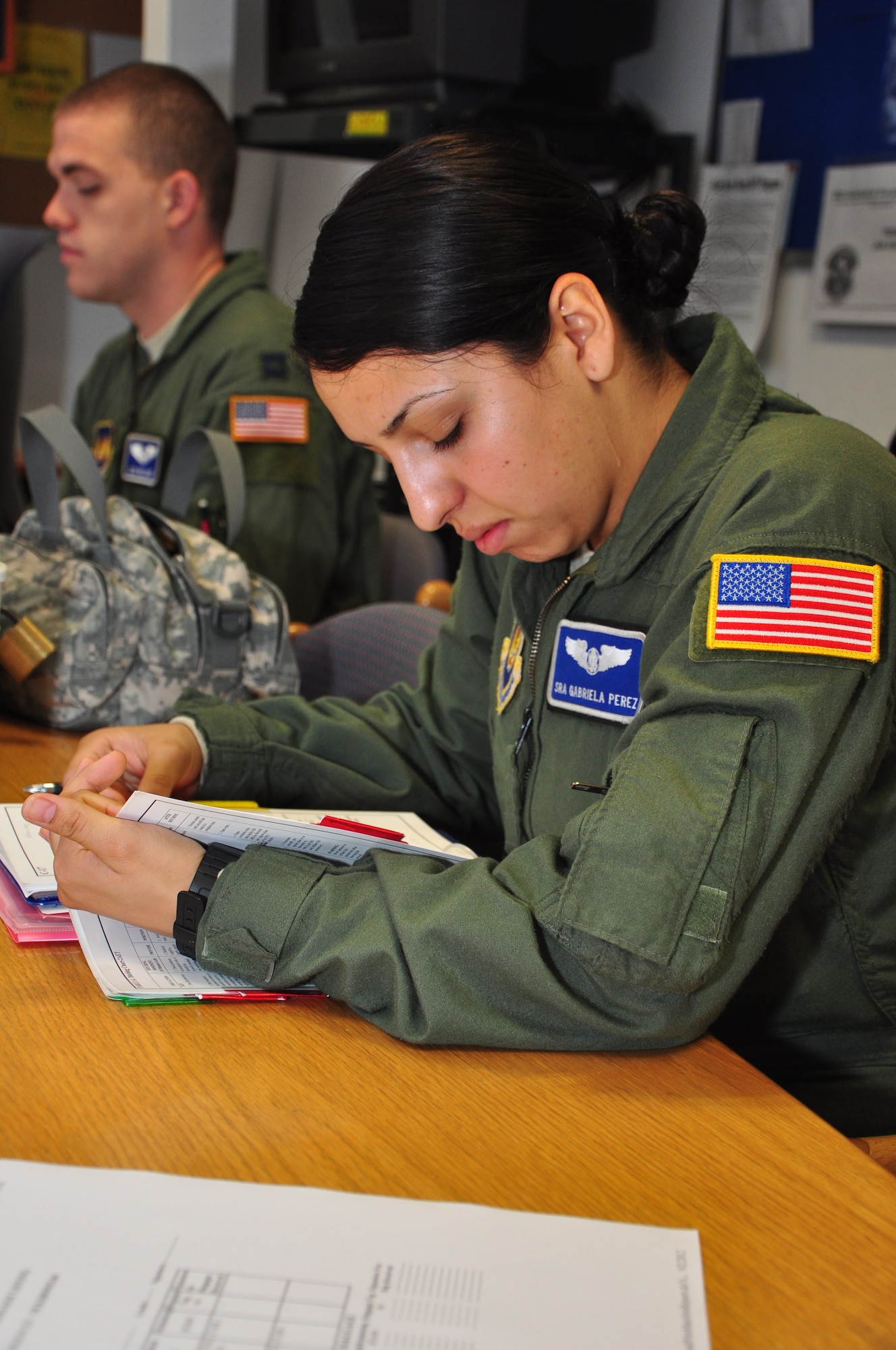 Senior Airmen Gabriela Perez, 86th Aeromedical Evacuation Squadron, reviews a safety checklist prior to a mission testing the squadron’s capabilities on a new airframe at Ramstein Air Base, Germany, Sept. 3, 2012. The squadron is hoping to start using the civilian Gulfstream III, or G3, aircraft for short missions to Africa and Eurasia. (U.S. Air Force photo/Tech. Sgt. Chad Thompson)