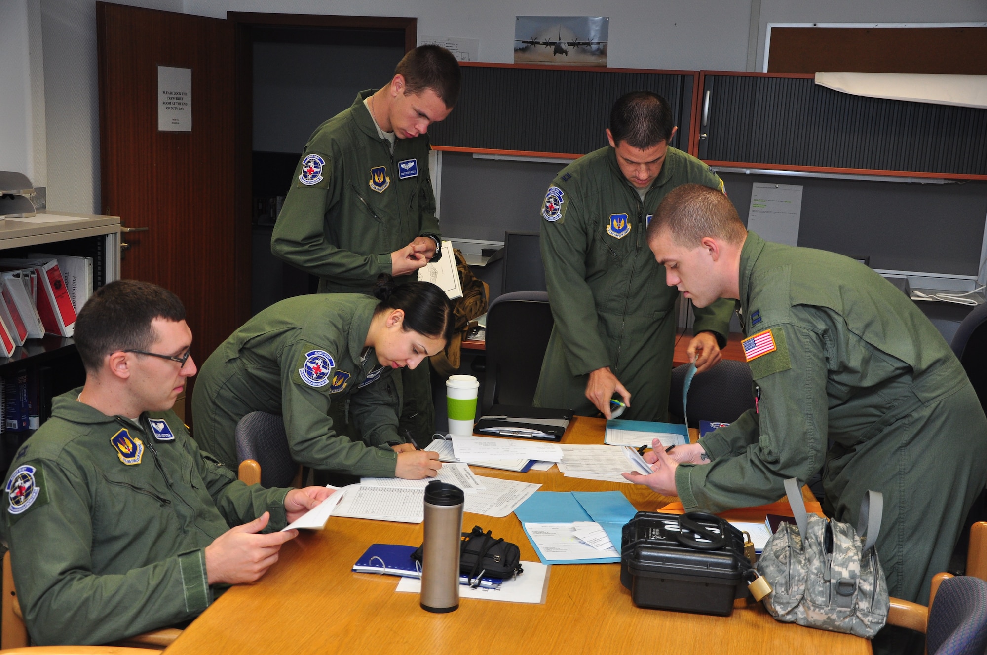 Members of the 86th Aeromedical Evacuation Squadron review checklists prior to a mission testing their capabilities on a new airframe at Ramstein Air Base, Germany, Sept. 3, 2012. The squadron is hoping to start using the civilian Gulfstream III, or G3, aircraft for short missions to Africa and Eurasia. (U.S. Air Force photo/Tech. Sgt. Chad Thompson)