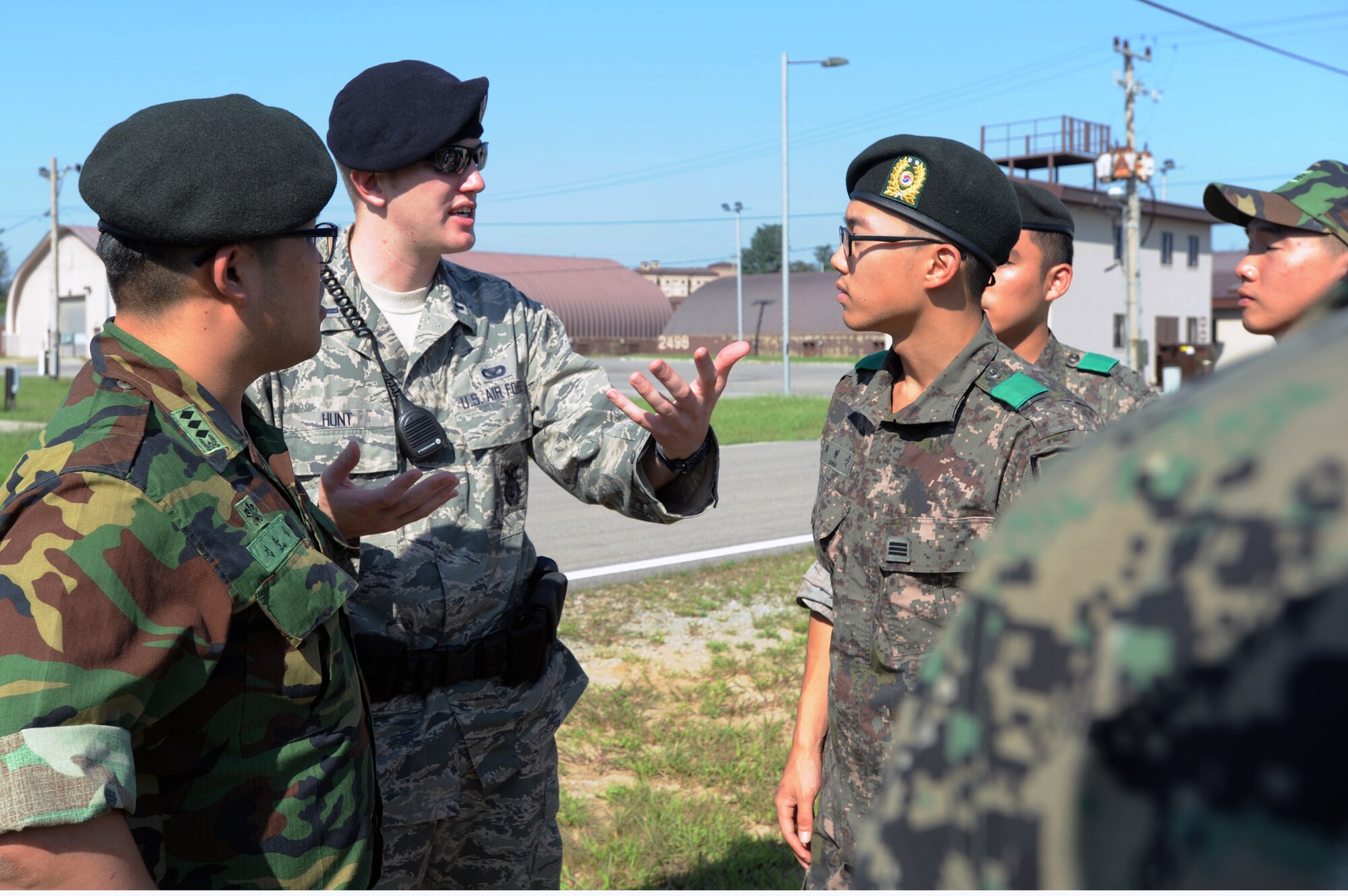Republic of Korea Army representatives talk with members of the 51st Security Forces Squadron Sept. 6, 2012, during a tour of defensive fighting positions at Osan Air Base. The tour was held to help strengthen the alliance between the two forces. (U.S. Air Force photo/Airman 1st Class Alexis Siekert)