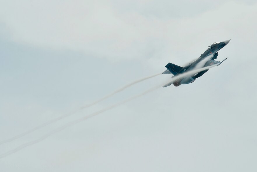 A Japan Air Self-Defense Force F-2 aircraft pilot demonstrates the multi-role fighter’s maneuverability during the Air Festival Sept. 9, 2012, at Misawa Air Base, Japan. Aircraft soared through the sky while others sat static for viewing during the Air Festival. (U.S. Air Force photo by Staff Sgt. Nathan Lipscomb/Released)