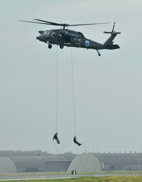 Japan Air Self-Defense Force search and rescue team repel out of a UH-60J helicopter during the Air Festival at Misawa Air Base, Japan, Sept. 9, 2012. The 2012 Misawa Air Festival featured aircraft and equipment from the U.S. military as well as Japan Air Self Defense Force. (U.S. Air Force photo by Staff Sgt. Nathan Lipscomb/Released)