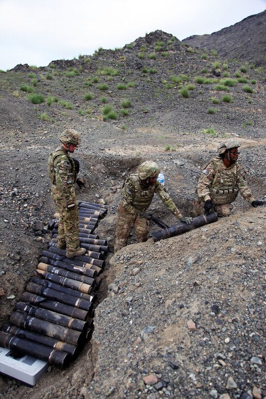 U.S. soldiers organize old ordnance for destruction at the demolition range on Forward Operating Base Salerno in Afghanistan's Khost province, Sept. 2, 2012.