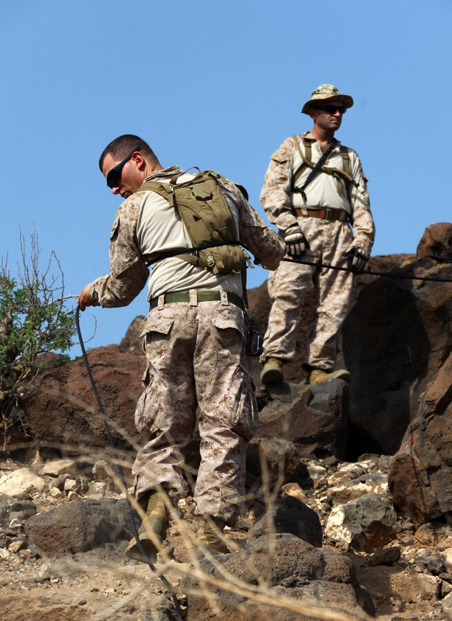 Marines with Bravo Company, Battalion Landing Team 1st Battalion, 2nd Marine Regiment, 24th Marine Expeditionary Unit, practice using rope to climb down mountainous terrain during assault climber training in Djibouti, Aug. 29, 2012. The training is a part of a Training Force, or T-Force, package focused on primitive infantry skills. The 24th MEU is deployed with the Iwo Jima Amphibious Ready Group as a theater reserve and crisis response force throughout the U.S. Central Command in the Navy's 5th Fleet area of responsibility.