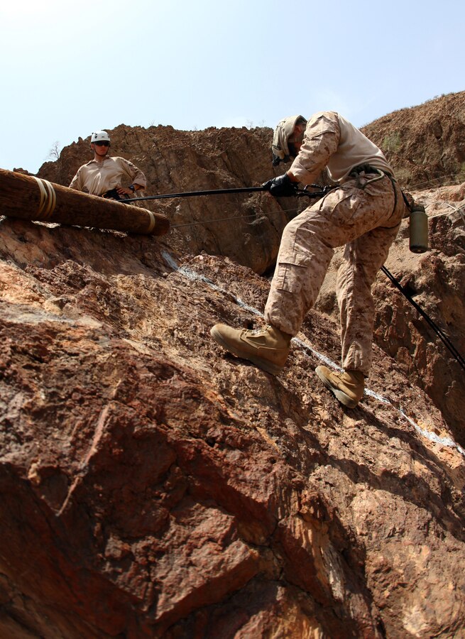 A Marine with Bravo Company, Battalion Landing Team 1st Battalion, 2nd Marine Regiment, 24th Marine Expeditionary Unit, rappels from a 150 ft. cliff during assault climber training in Djibouti, Aug. 29, 2012. The training is a part of a Training Force, or T-Force, package focused on primitive infantry skills. The 24th MEU is deployed with the Iwo Jima Amphibious Ready Group as a theater reserve and crisis response force throughout the U.S. Central Command in the Navy's 5th Fleet area of responsibility.